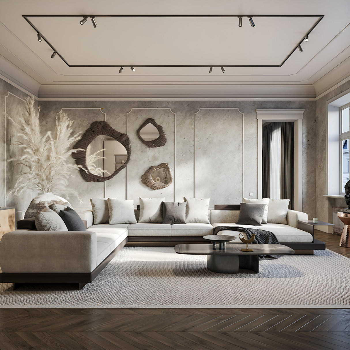 A modern living room includes a large gray sectional sofa with cushions, abstract wall art on a textured wall, and a sleek black coffee table on a light carpet. The stylish decor is enhanced by eco-friendly lighting from the Focus Zoom LED Unity Track Spotlight 12W 4000K - Black.