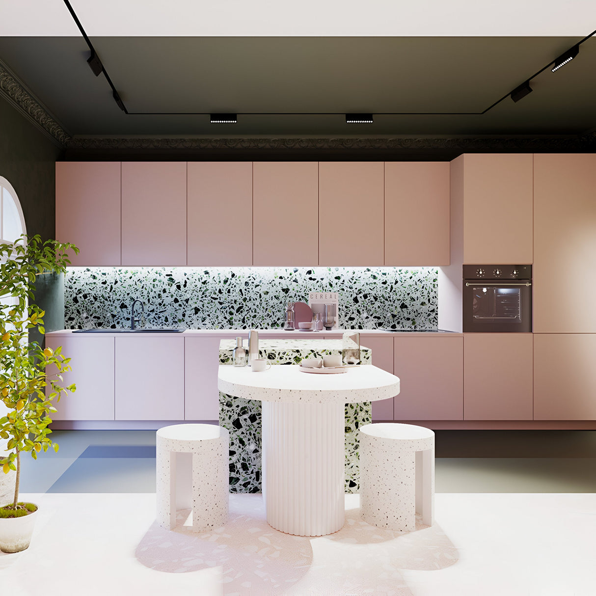 A modern kitchen features pink cabinetry, a black and white patterned backsplash, and an island with two round white stools. Dimmable Points Rot DALI CCT LED Adjustable Linear Track Lights in black contrast with the light flooring. A potted plant sits on the left side near the island.