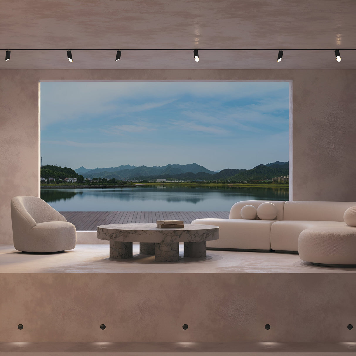 In a modern living room with minimalist furniture, a large window reveals a tranquil lake and distant mountains under a blue sky. The Lipari Single Phase Unity Track Spotlight - Black highlights the round marble table and two cushy white chairs with its adjustable heads.