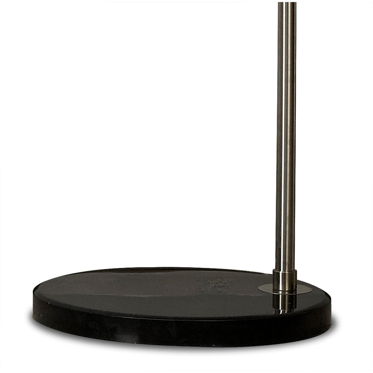 A close-up of the Kinke Floor Lamp With Hook - Black reveals its sleek black stainless steel base with a round, flat platform and a vertical metallic pole extending upward from the edge.