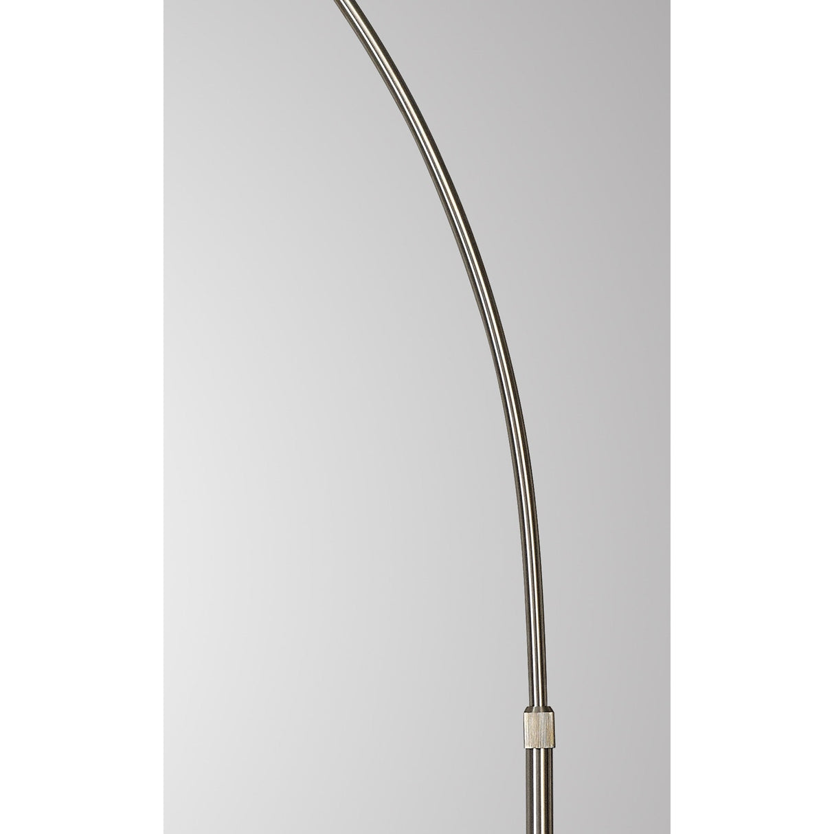 A close-up of the Kinke Floor Lamp With Hook - Black shows its curved black stainless steel rod and small rectangular connector against a plain light gray background.