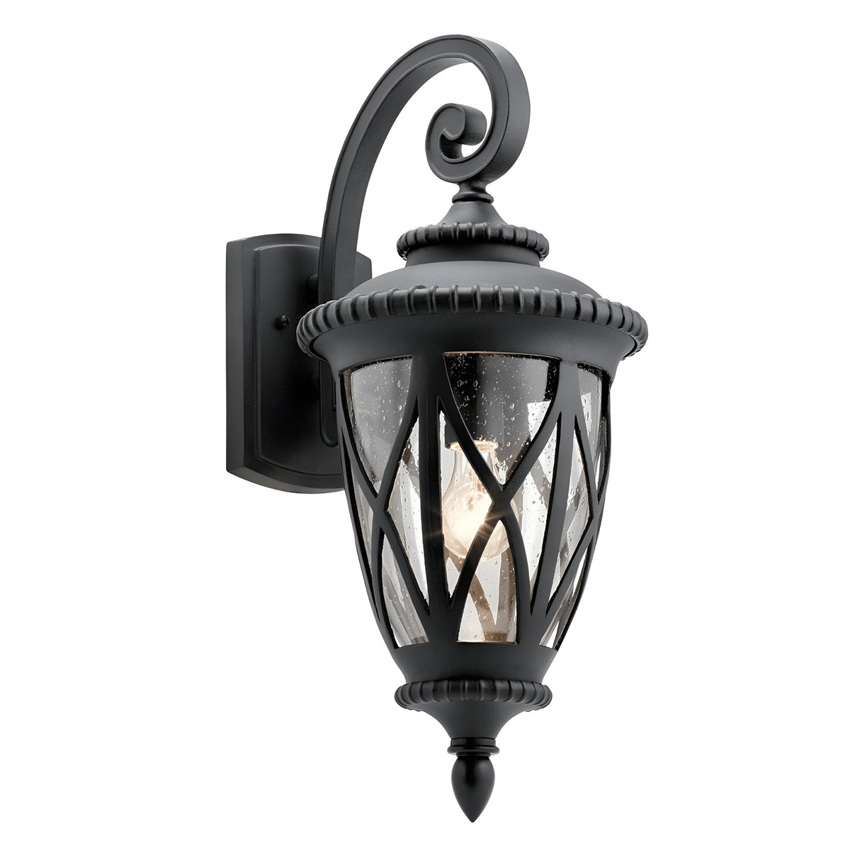 The Admirals Cove Outdoor 1 Light Large Wall Lantern in black boasts a vintage-style design with a decorative scroll motif, exuding Tudor-inspired elegance. Its clear glass panels showcase a crisscross pattern that gracefully displays the light bulb within, making it a stunning addition to any outdoor lighting setup.