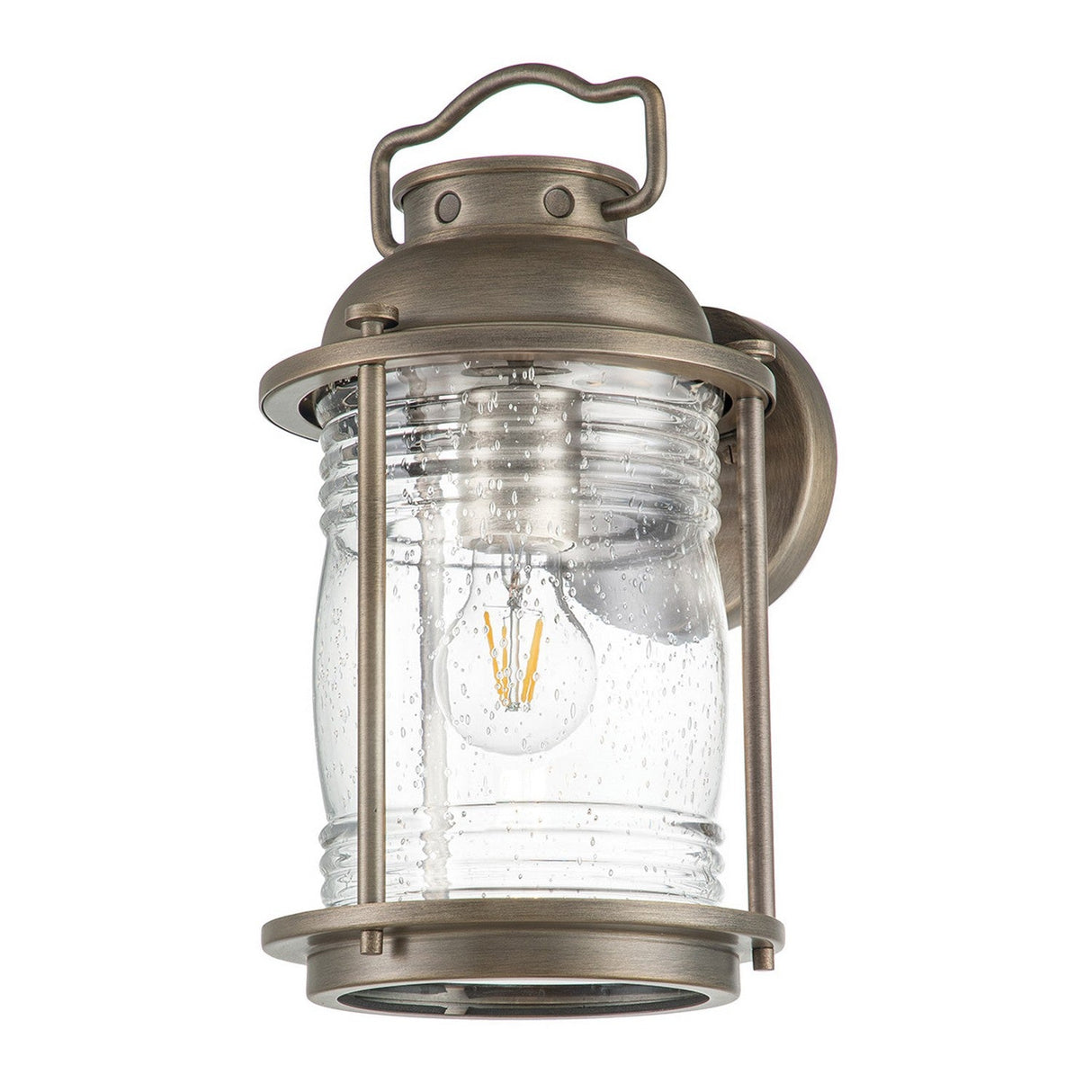 The Ashland Bay Outdoor 1 Light Medium Wall Lantern in Burnished Bronze exudes vintage charm with its clear seeded glass shade, showcasing a visible filament bulb inside.