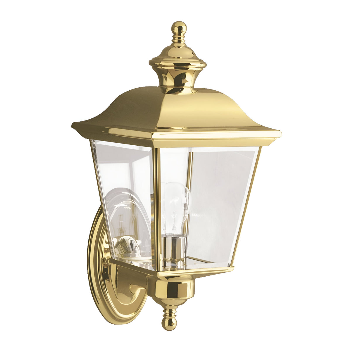 The Bay Shore Outdoor 1 Light Medium Outdoor Wall Light in polished brass showcases a classic design with a clear beveled glass enclosure that encases a bulb. This fixture is mounted on an elegant brass base, perfect for adding sophistication to exterior walls.