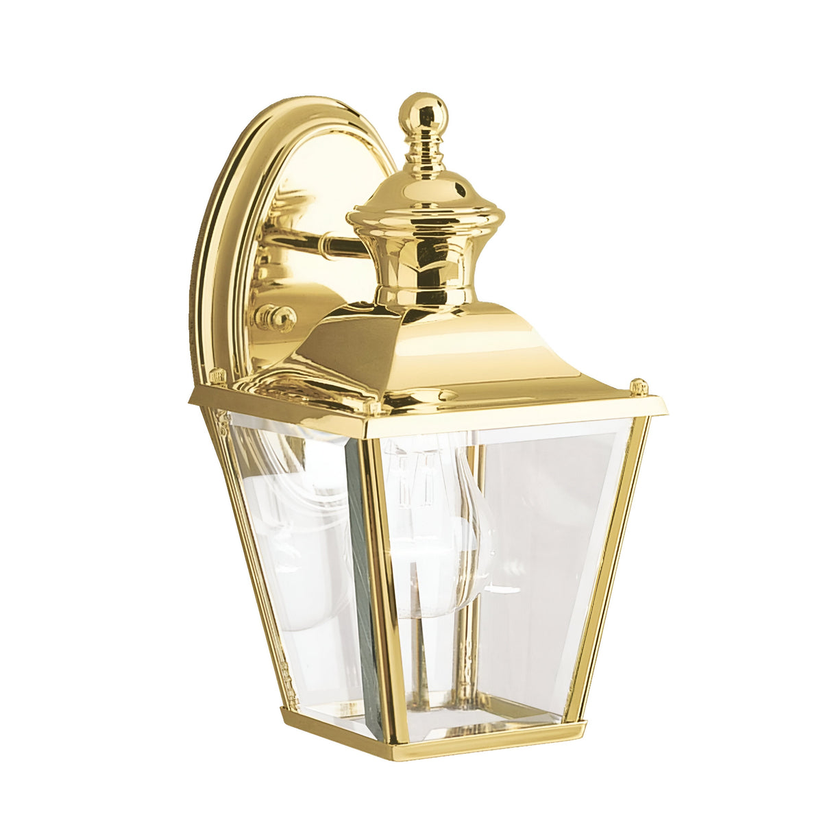The Bay Shore Outdoor 1 Light Small Outdoor Wall Light in polished brass showcases a classic design with a clear beveled glass enclosure and a single light bulb inside. This elegant lantern is mounted on a decorative round brass plate, enhancing the charm of any exterior space.