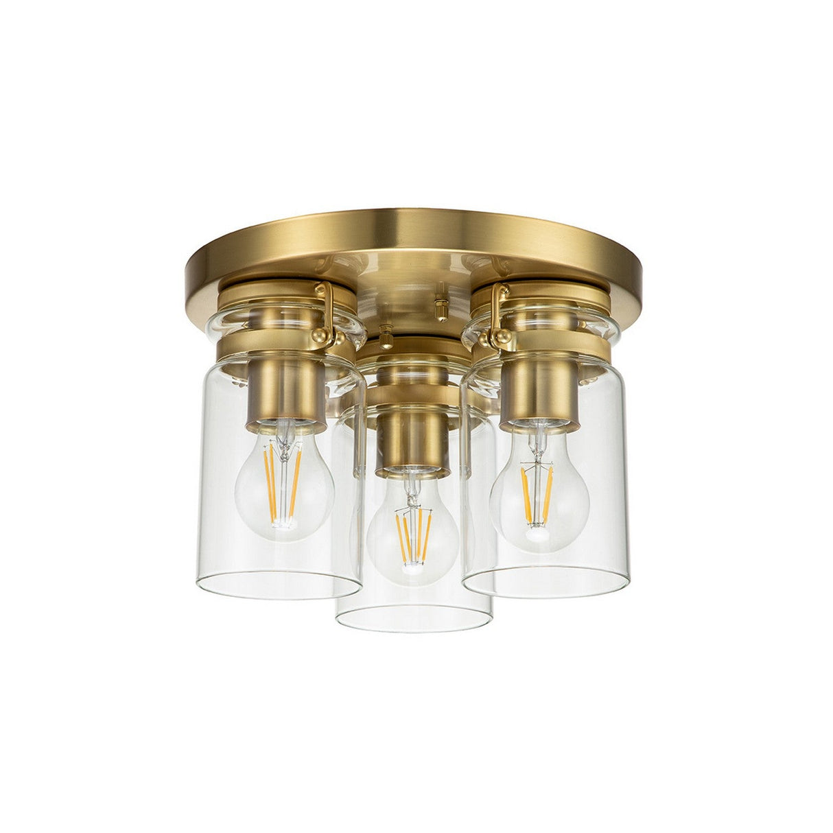 The Brinley 3 Light Flush - Brushed Brass showcases a contemporary ceiling fixture with a brushed brass round base and three exposed bulbs. Each bulb is enclosed in a clear cylindrical glass shade, infusing the minimalist design with vintage charm.