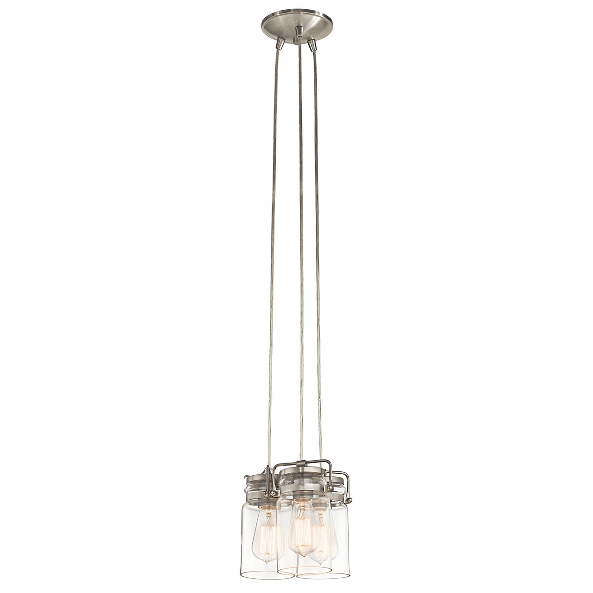 Introducing the Brinley 3 Light Pendant - Brushed Nickel, a vintage-inspired fixture featuring a brushed nickel finish. This modern design includes three hanging mason jar-style glass shades that elegantly display exposed bulbs. With its metal base and sleek supporting wires, it masterfully combines classic charm with contemporary flair.
