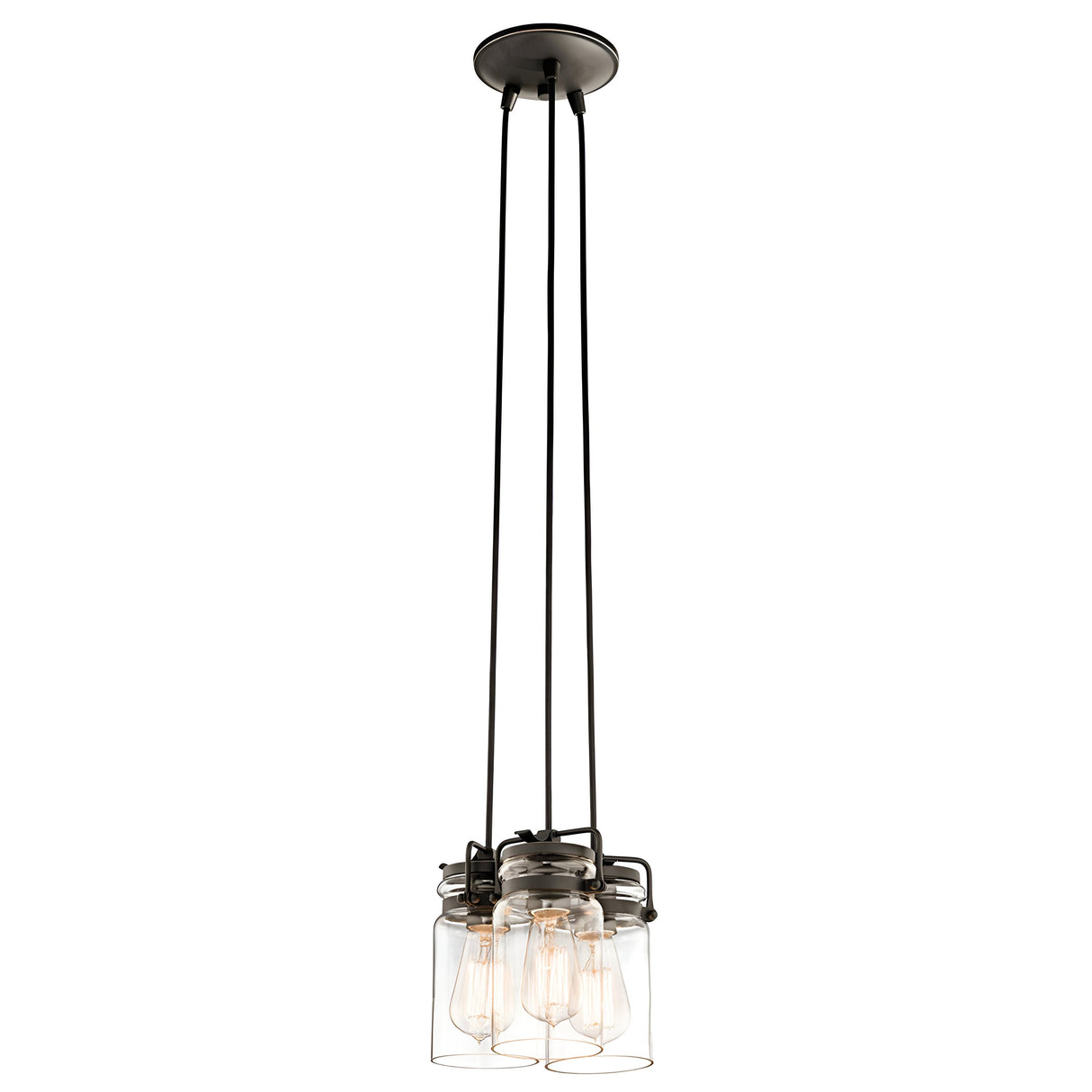 The Brinley 3 Light Pendant in bronze is a contemporary industrial light fixture that exudes vintage charm. It features three hanging Edison bulbs encased in clear glass jars and suspended by black cords from a circular bronze ceiling mount.