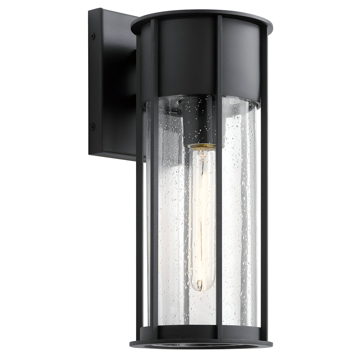 Introducing the Camillo Outdoor 1 Light Medium Wall Lantern - Black, showcasing a sleek cylindrical design with a sophisticated black finish. Its clear seeded glass enclosure adds elegance with delicate bubble patterns, perfectly framing an exposed filament-style bulb for an enhanced ambience.