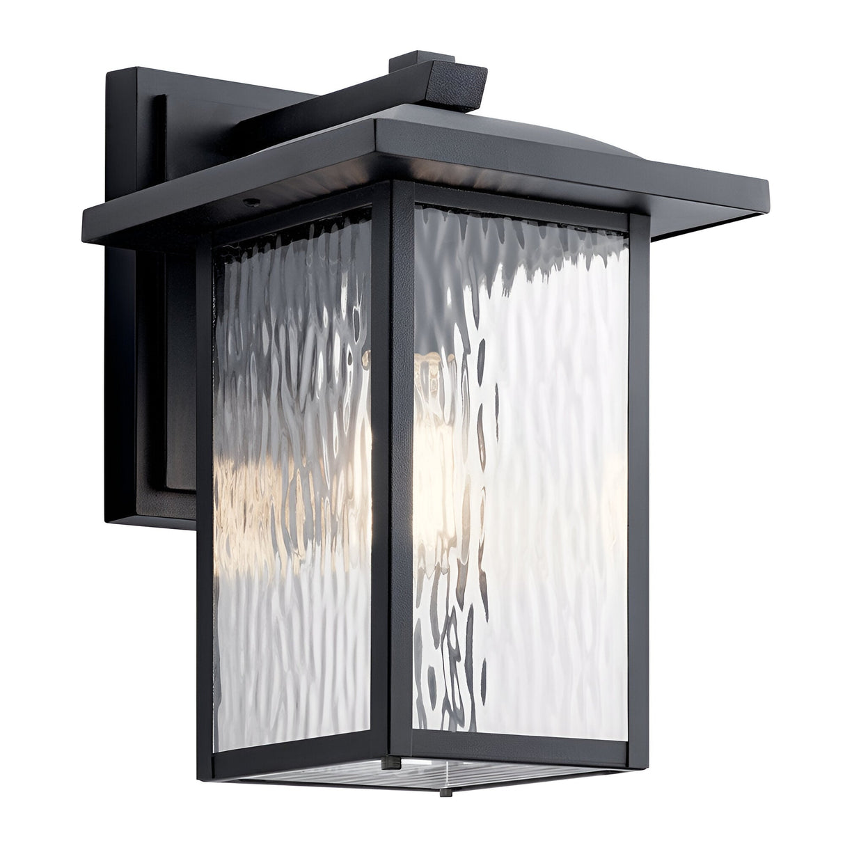 The Cappanna 1 Light Outdoor Medium Wall Lantern in textured black features a durable metal frame, waterfall glass panels, and weather resistance. Mounted on a rectangular backplate, it provides a soft, warm light for outdoor spaces.
