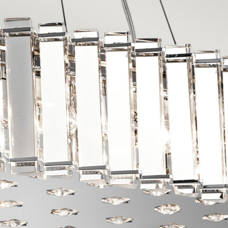 A close-up of the sleek Crystal Skye 12 Light Island Chandelier reveals its modern design featuring rectangular prisms with a crystal-like appearance that reflect light beautifully. Part of the exquisite Crystal Skye collection, these prisms have a chrome finish, enhancing their shine as they project reflections on a light gray background.