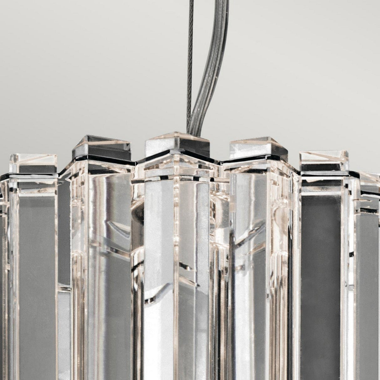 A close-up of the Crystal Skye 2 Light Mini Pendant - Chrome, featuring vertical crystal prisms and chrome accents. The clear crystals beautifully reflect light, adding an elegant and sophisticated touch against the neutral gray background.