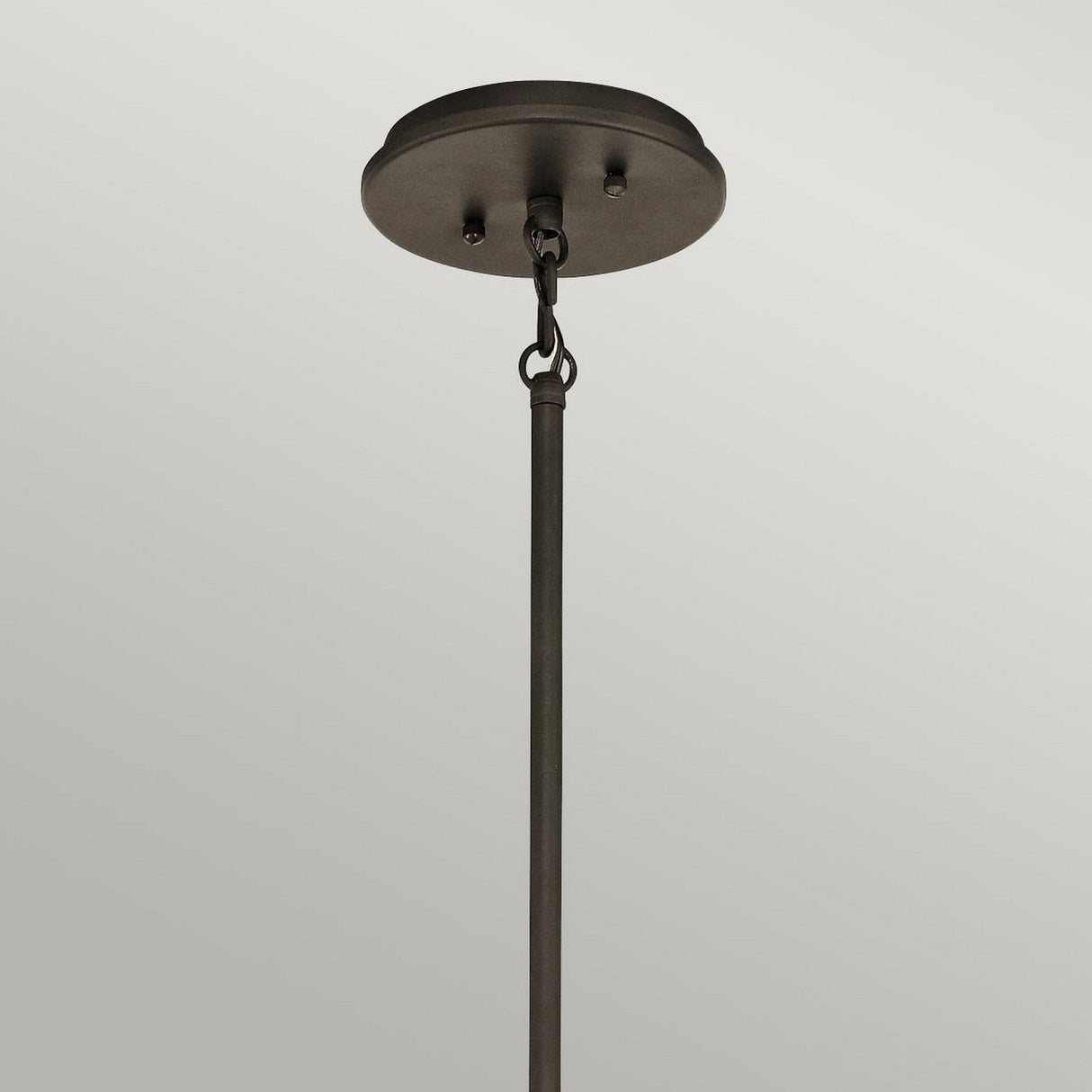 A close-up of the Emory 3 Light Duo-Mount Pendant/Semi-Flush in Olde Bronze, showcasing its circular base and elongated rod design. This contemporary lighting fixture is displayed against a plain, light gray background.