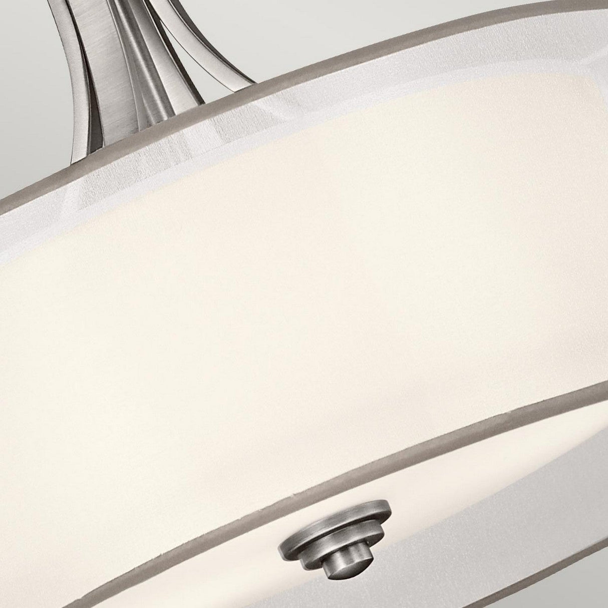 Close-up of the Lacey 4 Light Large Pendant in Silver, featuring a brushed metal finish. The frosted white shade, integral to its double-shade design, is secured by a central metal piece, offering a sleek and contemporary aesthetic against a neutral background.