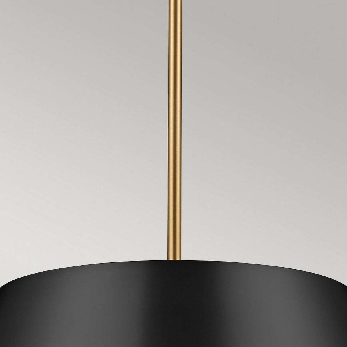 Close-up of the Luella 3 Light Duo-Mount Chandelier/Semi-Flush in black and brass, showcasing a sleek gold rod against a neutral background.