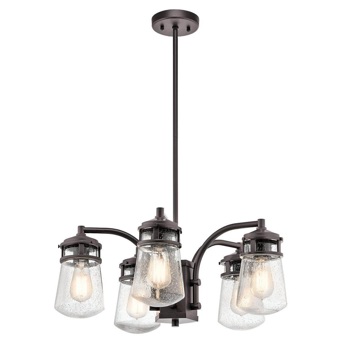 The Lyndon Outdoor 5 Light Chandelier in bronze, with seedy glass shades and exposed filament bulbs, emits a charming glow. This fixture hangs from a rod and exudes a rustic, industrial vibe, making it perfect for enhancing your outdoor space with its architectural elegance.