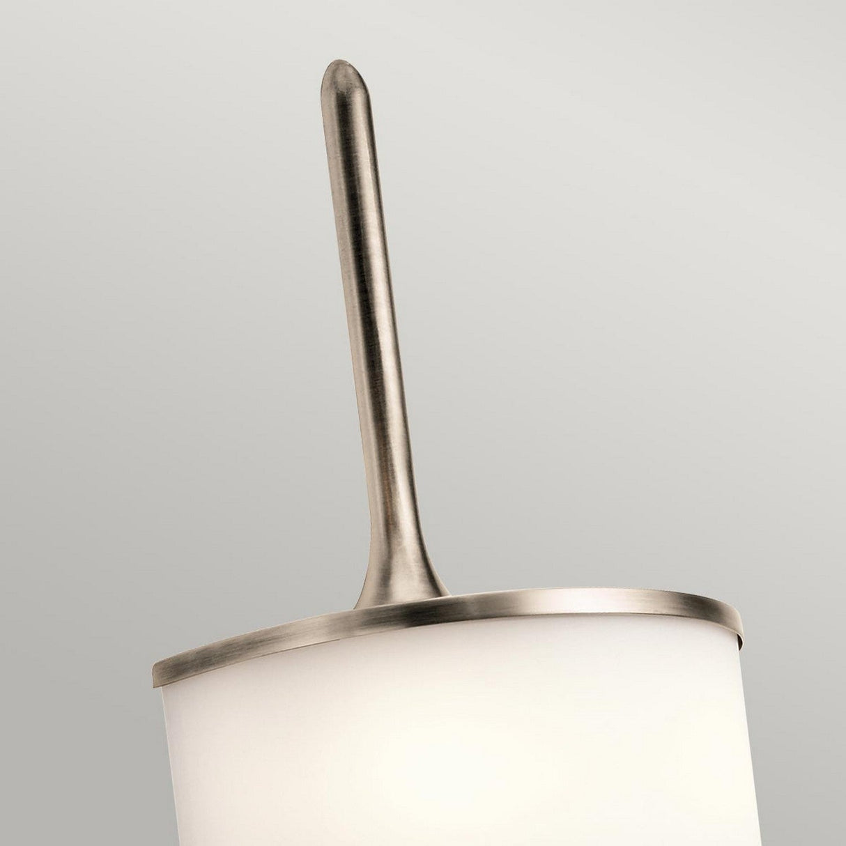 Introducing the Mona 2 Light Small Wall Light in a sophisticated silver finish, featuring a sleek, smooth metal rod topped with a cylindrical white shade. This modern lighting solution is enhanced by energy-efficient G9 LED lamps, presenting an elegant look against a simple backdrop.