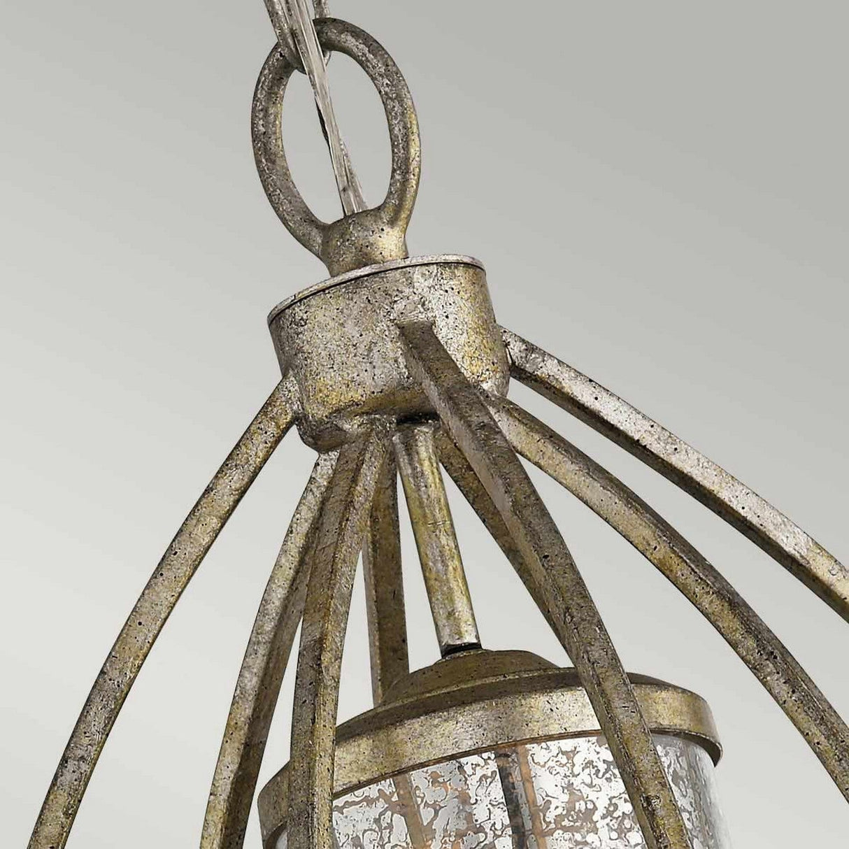 Close-up of the Rosalie 1 Light Pendant - Sterling Gold, a metallic hanging light with a weathered finish. It features curved metal rods forming a cage-like structure around an antique mercury glass cylinder, set against a neutral gray background.