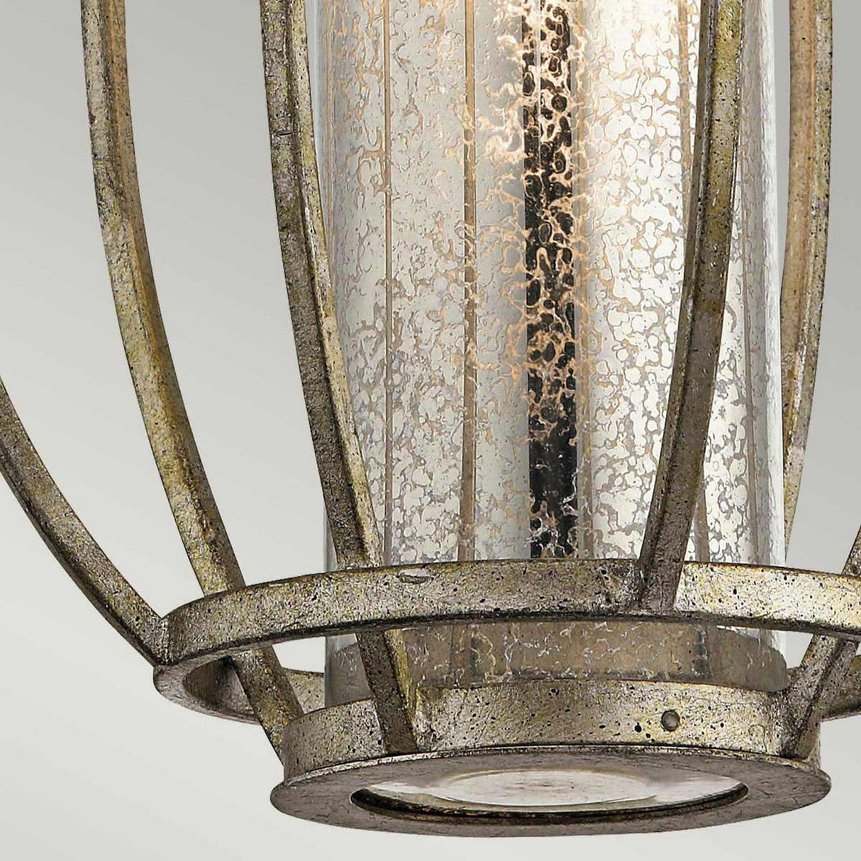 Close-up of the Rosalie 1 Light Pendant in Sterling Gold, featuring a metal frame and speckled glass that resembles classic antique mercury glass. Designed for outdoor use, it boasts mottled glass patterns for added texture, with a weathered frame that offers an antique look inspired by classic Williamsburg design.