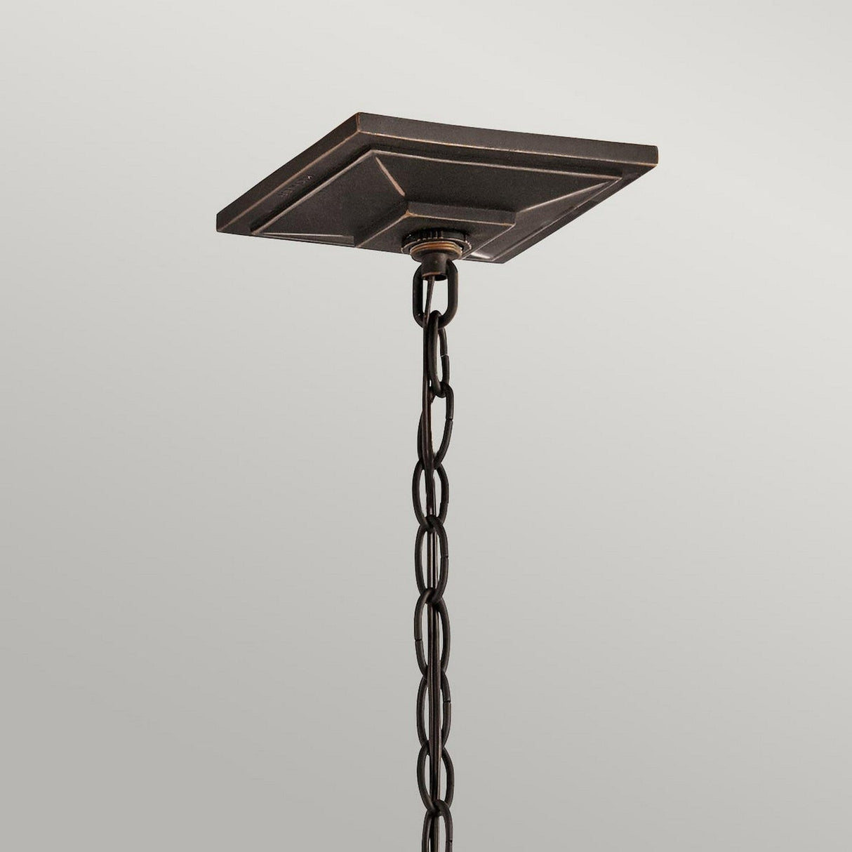 The image showcases a detailed view of the South Hope Outdoor 1 Light Small Chain Pendant in rubbed bronze, featuring a decorative chain and a square, stepped ceiling mount. The pendant stands out against a simple light gray background.