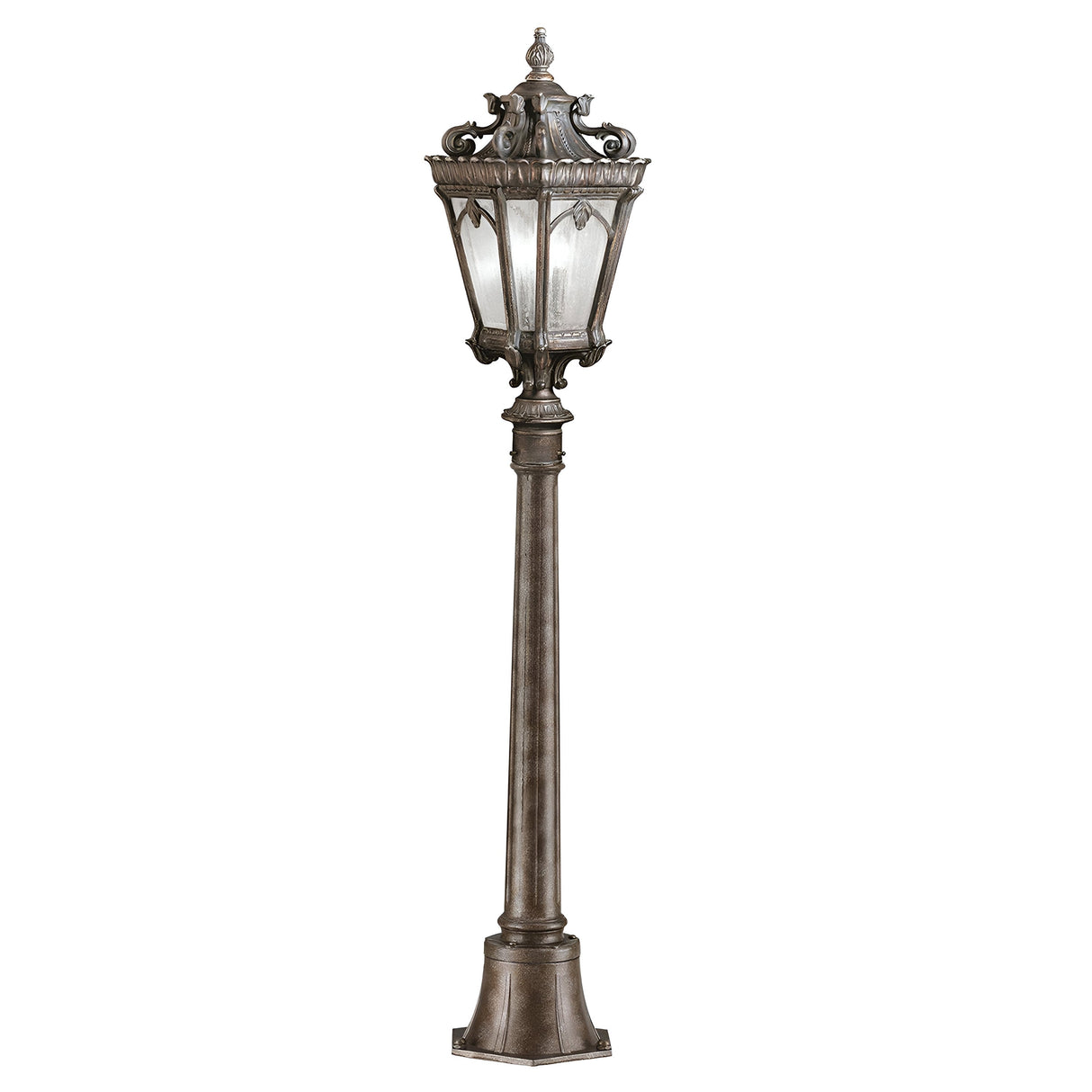 The Tournai 1 Light Medium Pillar in Bronze is a vintage-style street lamp crafted from hand-cast aluminum, characterized by its intricate metalwork and a frosted glass lantern. It boasts a tall, slender post with a decorative base, capturing the essence of elegance.