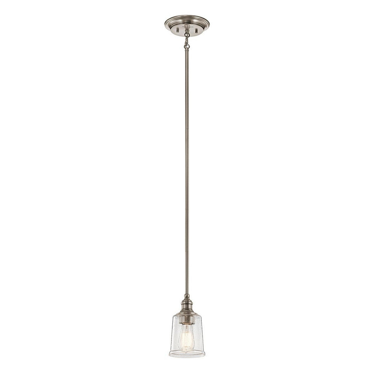The Waverly 1 Light Mini Pendant in silver boasts a single, modern design that hangs from the ceiling. It showcases a clear glass shade and a visible bulb, providing a minimalist yet elegant look ideal for those who appreciate vintage style.