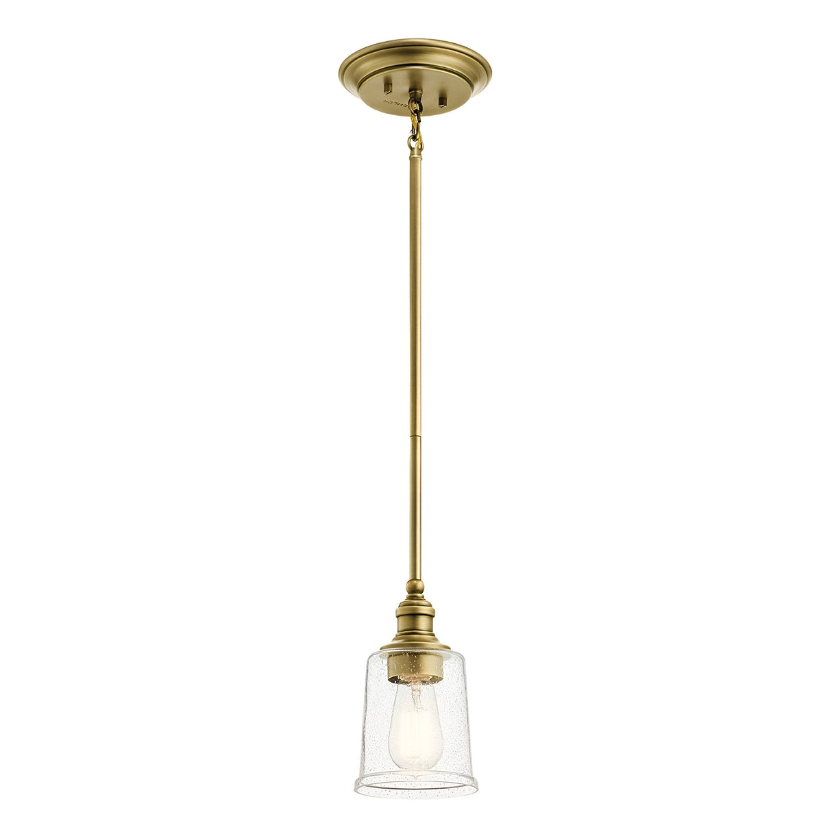 The Waverly 1 Light Mini Pendant - Natural Brass boasts a vintage-inspired design with a clear glass shade and an exposed bulb. Its straight brass rod connects seamlessly to the ceiling mount, creating a perfect blend of classic charm and modern aesthetics.