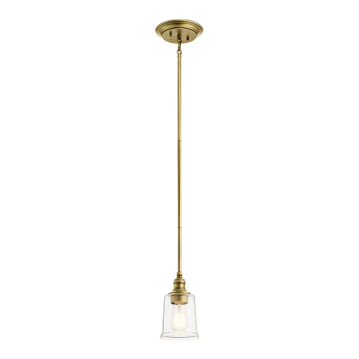 The Waverly 1 Light Mini Pendant in natural brass features a vintage-inspired design with a clear glass shade, suspended elegantly from the ceiling to reveal an exposed bulb within its sleek, minimalist fixture.