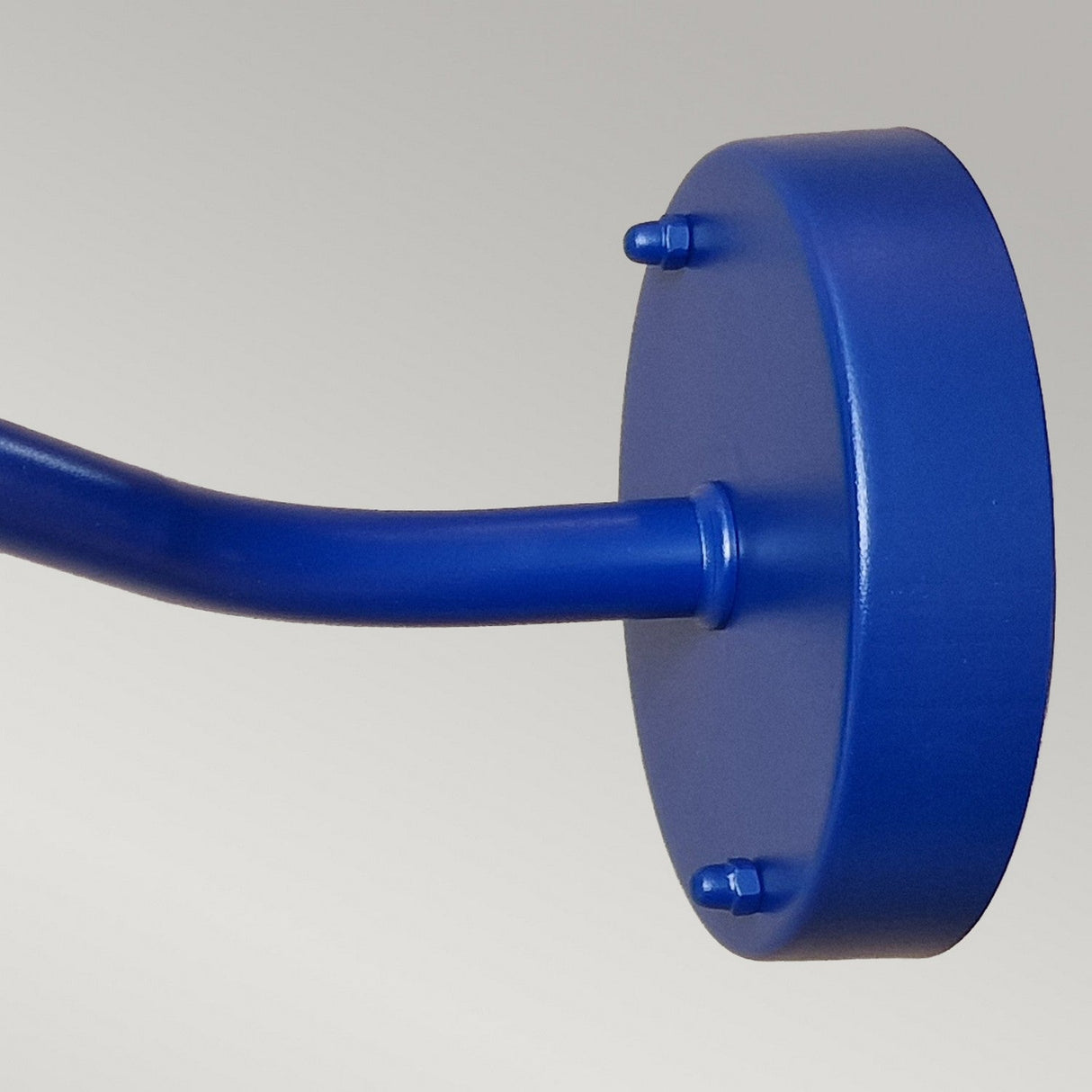 Close-up of the Klampenborg 1 Light Outdoor Wall Light in navy blue, featuring a curved, extending arm that highlights its Scandinavian-inspired design. The neutral background accentuates the minimalist appeal of this IP44-rated fixture.