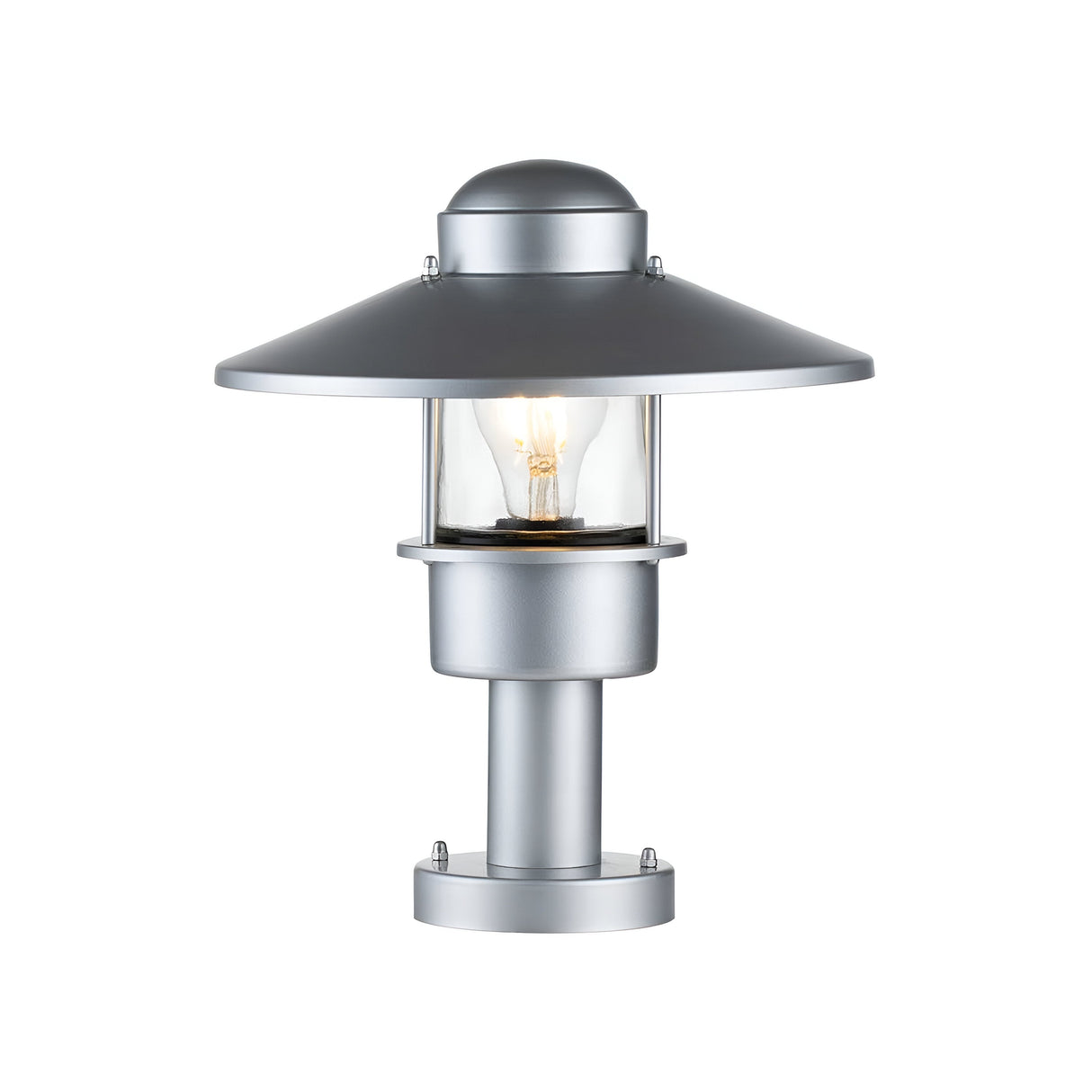 The Klampenborg 1 Light Pedestal - Silver is a modern outdoor wall sconce that combines Scandinavian design and functionality. It has a metallic finish and features a cylindrical base, clear glass enclosure showcasing a visible incandescent bulb, and a wide flat dome-shaped top shade for elegant outdoor lighting.