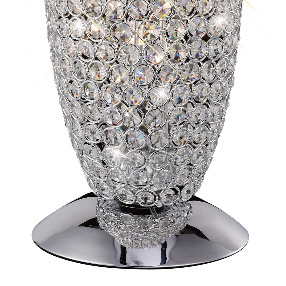 A close-up of the Kos 3 Light Crystal Table Lamp in polished chrome, featuring a vase covered in circular faceted crystals that reflect light for sparkling effects, creating a striking modern centerpiece.