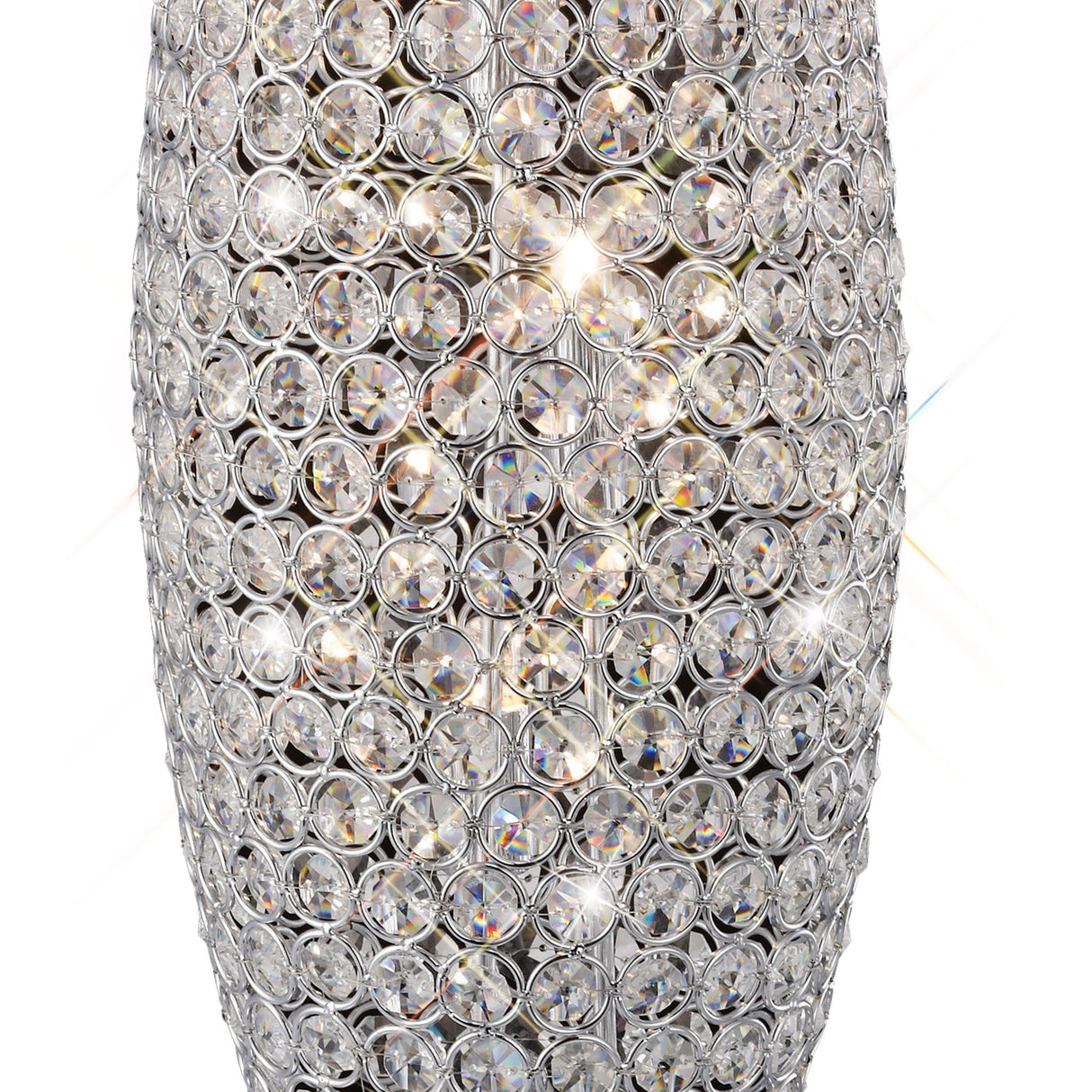 A close-up of the Kos 3 Light Crystal Table Lamp in polished chrome, featuring circular faceted crystals in a silver grid that reflect and refract light for sparkling, modern style—an eye-catching lamp for any space.