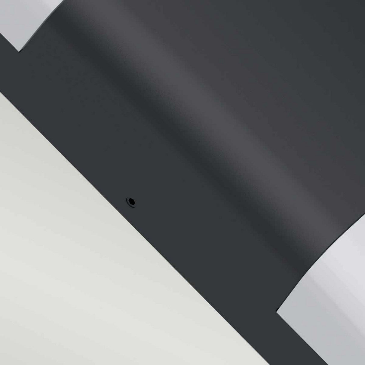 A close-up view of the Lars LED Outdoor Wall Light - Black highlights its sleek, modern design with smooth, angular lines and a monochromatic color scheme. The image captures contrasting dark and light surfaces with a small circular detail near the center, enhancing its contemporary aesthetic.