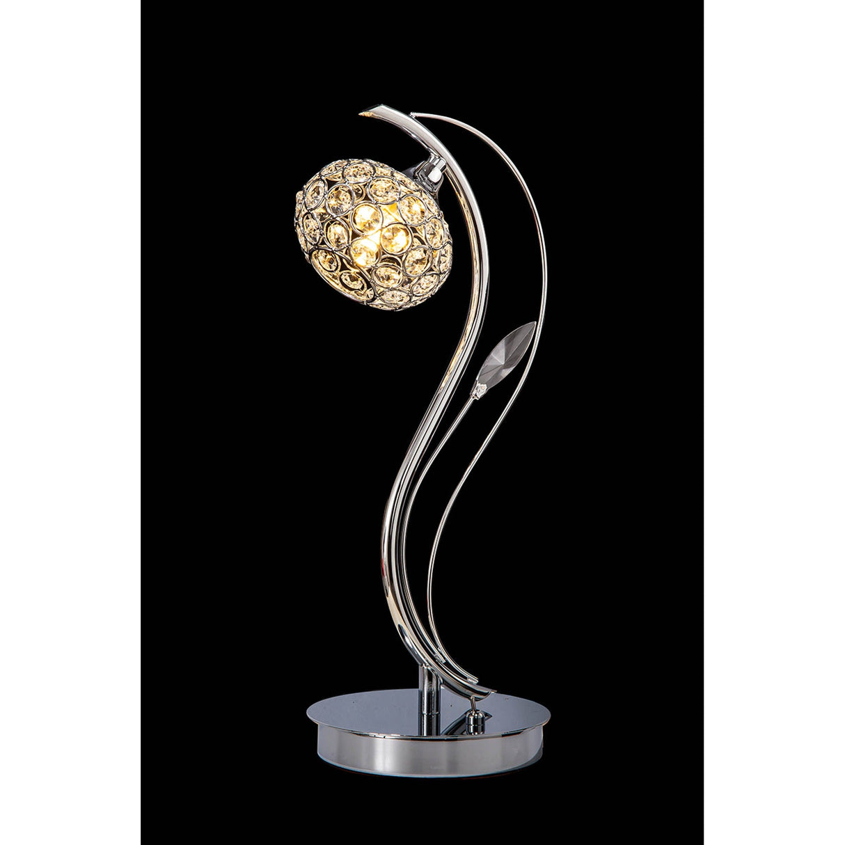 The Leimo 1 Light Crystal Table Lamp features a curved polished chrome base and a spherical shade with crystal-like accents, casting a warm glow against a black background.