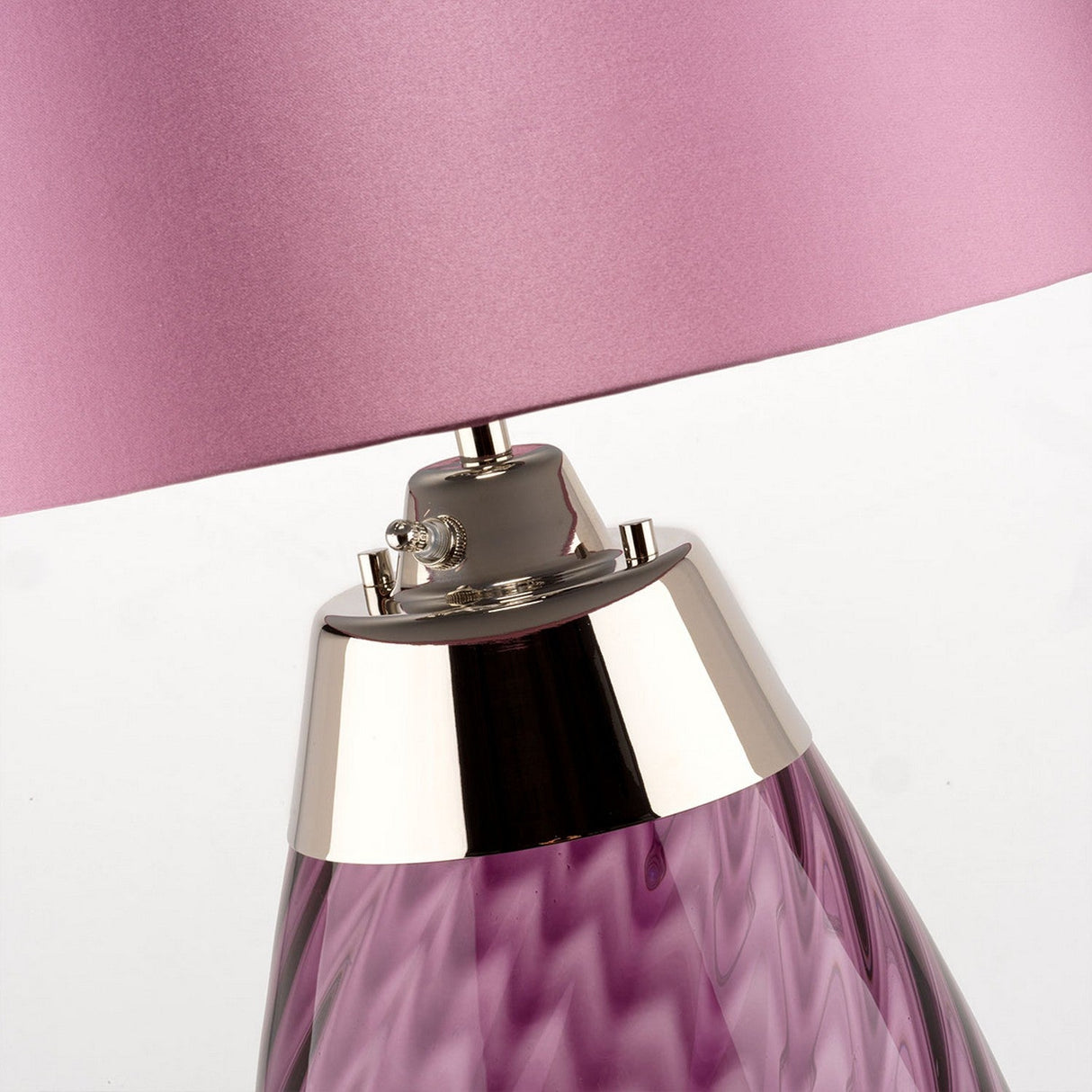 Close-up of the Lena 2 Light Large Plum Table Lamp with a Heather Shade, showcasing its modern metallic fixture. The base is made from textured, plum mouth-blown glass with a spiraled pattern, offering an elegant and contemporary style.