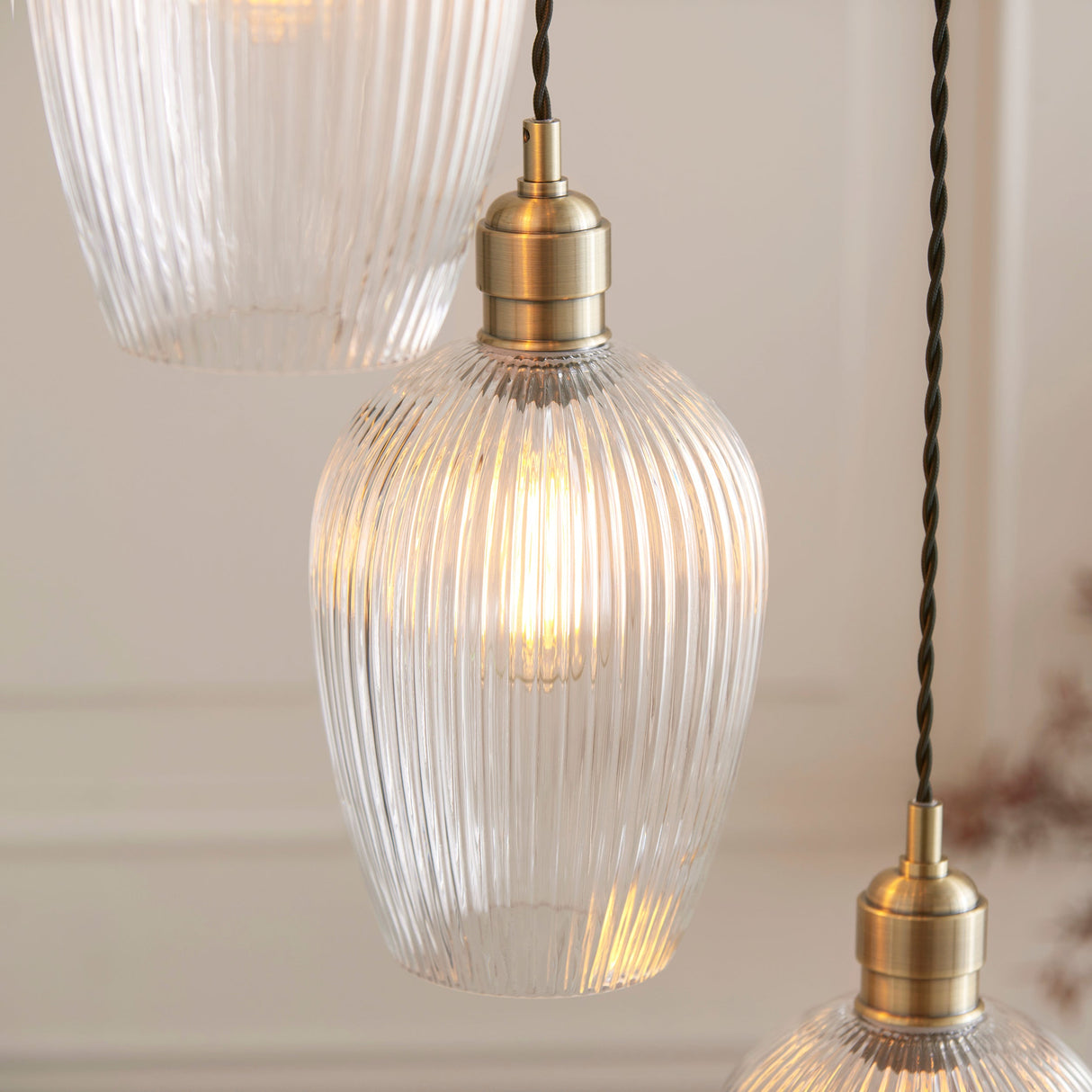 Fennhollow Ribbed Cascade 7 Light Pendant - Antique Brass Clear