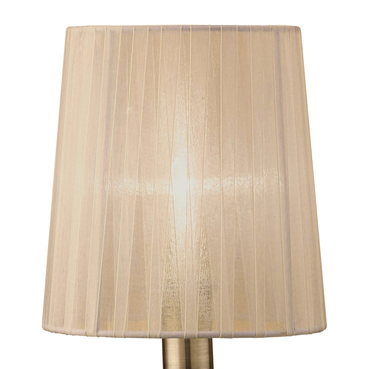 The Loewe Small 1 Light Table Lamp in antique brass with a bronze pleated shade casts warm ambient light, highlighting the elegant vertical pleats of its fabric shade.