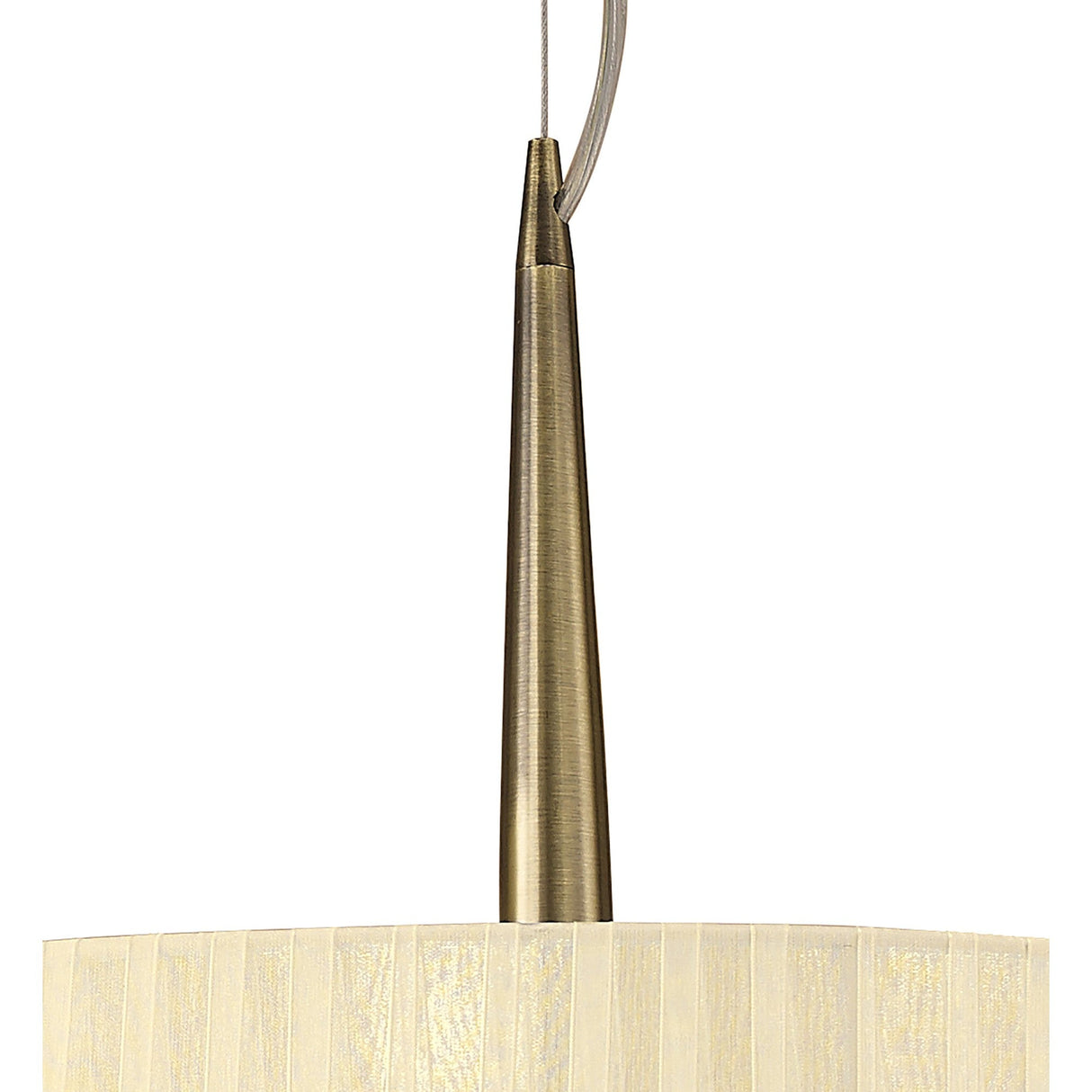 Close-up of the Mantra Loewe pendant light showing the tapered antique brass stem and top of a cream pleated organza shade against a white background.