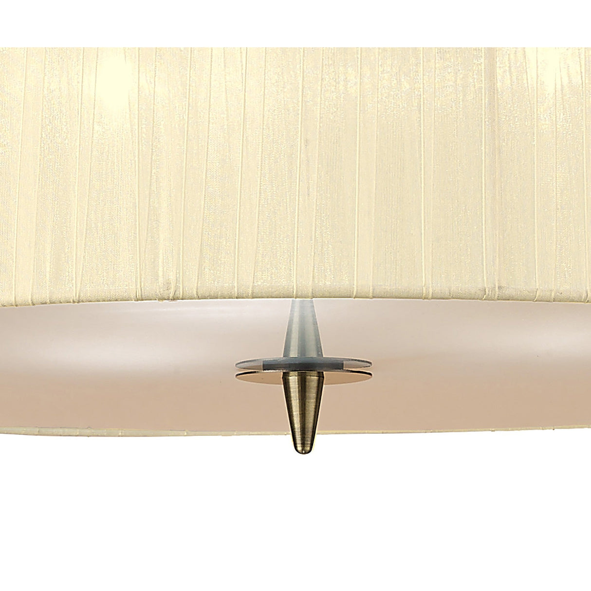 Close-up of Mantra Loewe pendant light showing cream pleated organza shade edge with antique brass cone finial detail on a white background.