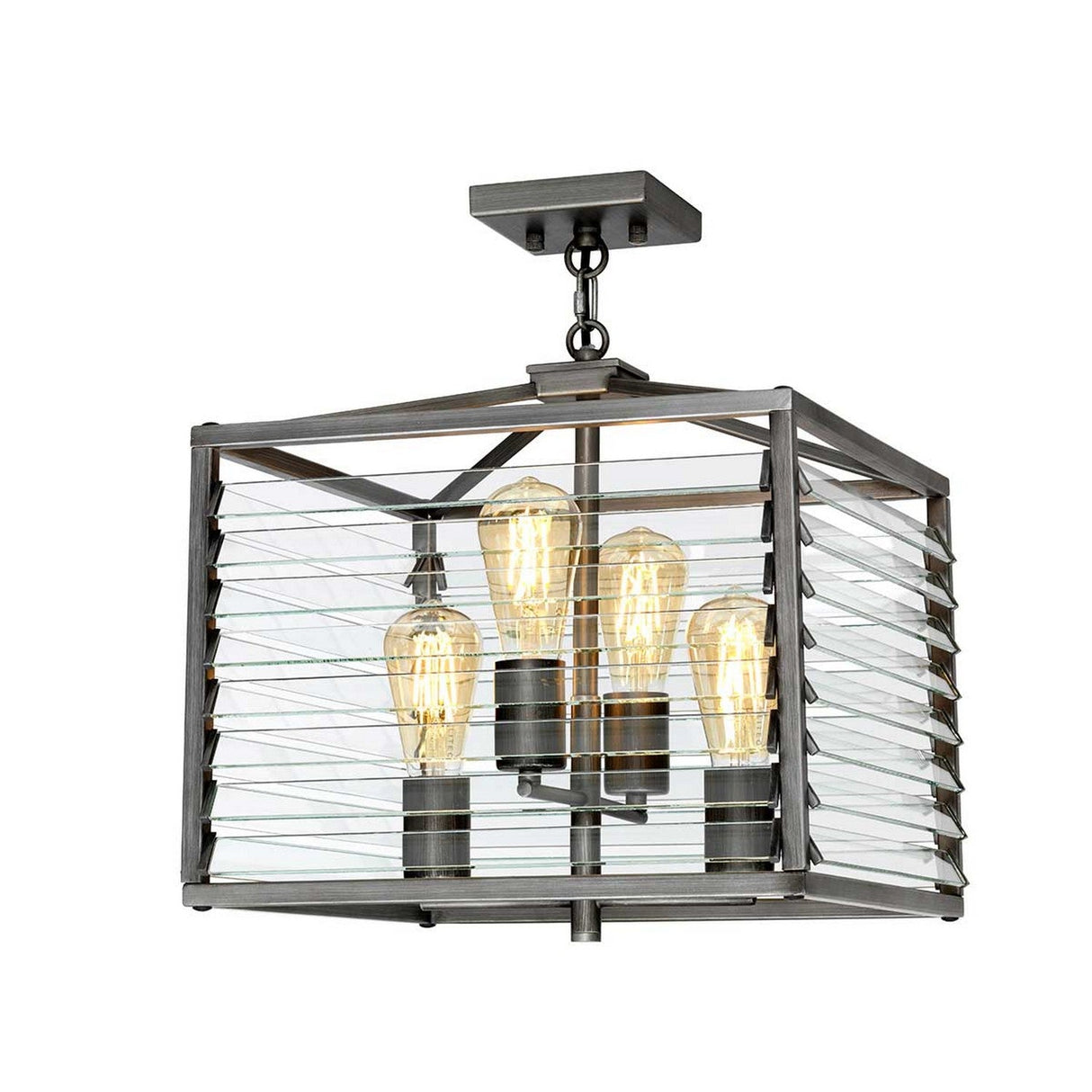 The Louvre 4 Light Chandelier - Graphite boasts a modern industrial style, featuring a graphite finish. It displays three exposed vintage-style bulbs within a rectangular metal frame adorned with horizontal slats, all gracefully hanging from a square ceiling mount.
