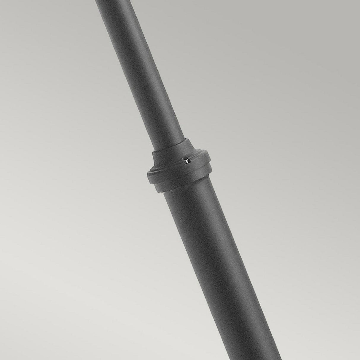 Close-up of the Lund 1 Light Lamp Post - Black, featuring a connecting joint that resembles a telescopic post, positioned diagonally against a light gray background.