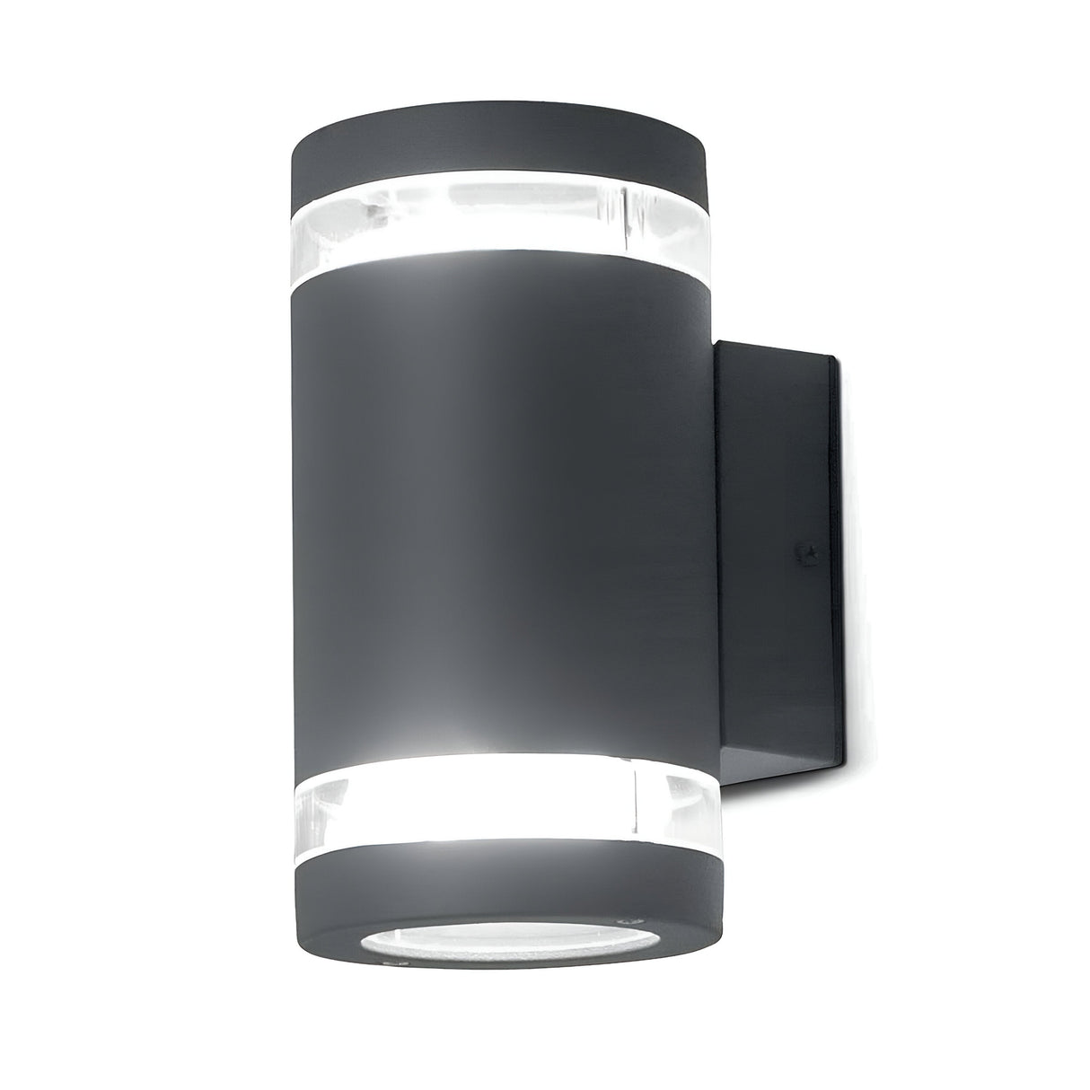 The Magnus 2 Light Outdoor Wall Light - Graphite features a sleek cylindrical design with a graphite finish. It emits a soft glow both from the top and bottom, beautifully mounted on a square black backplate, making it an elegant addition to any outdoor space.