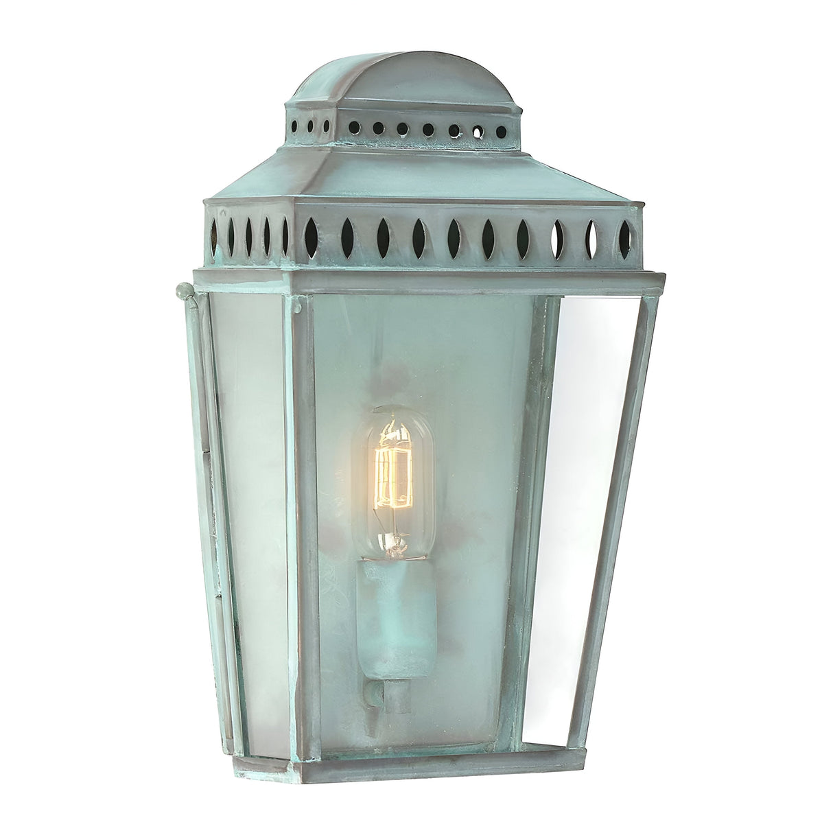 The Mansion 1 Light Outdoor Wall Light in verdigris features a vintage-style patina finish, a clear glass panel, and a visible incandescent bulb. This lantern showcases a classic rectangular shape with a domed top and decorative cutouts, embodying timeless design.