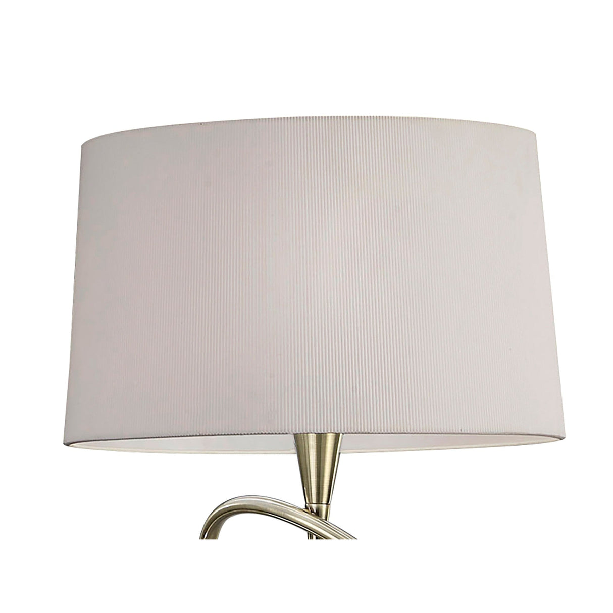 A close-up of the Mara 4 Light Floor Lamp, featuring an antique brass base and an ivory white pleated shade, set against a white background.