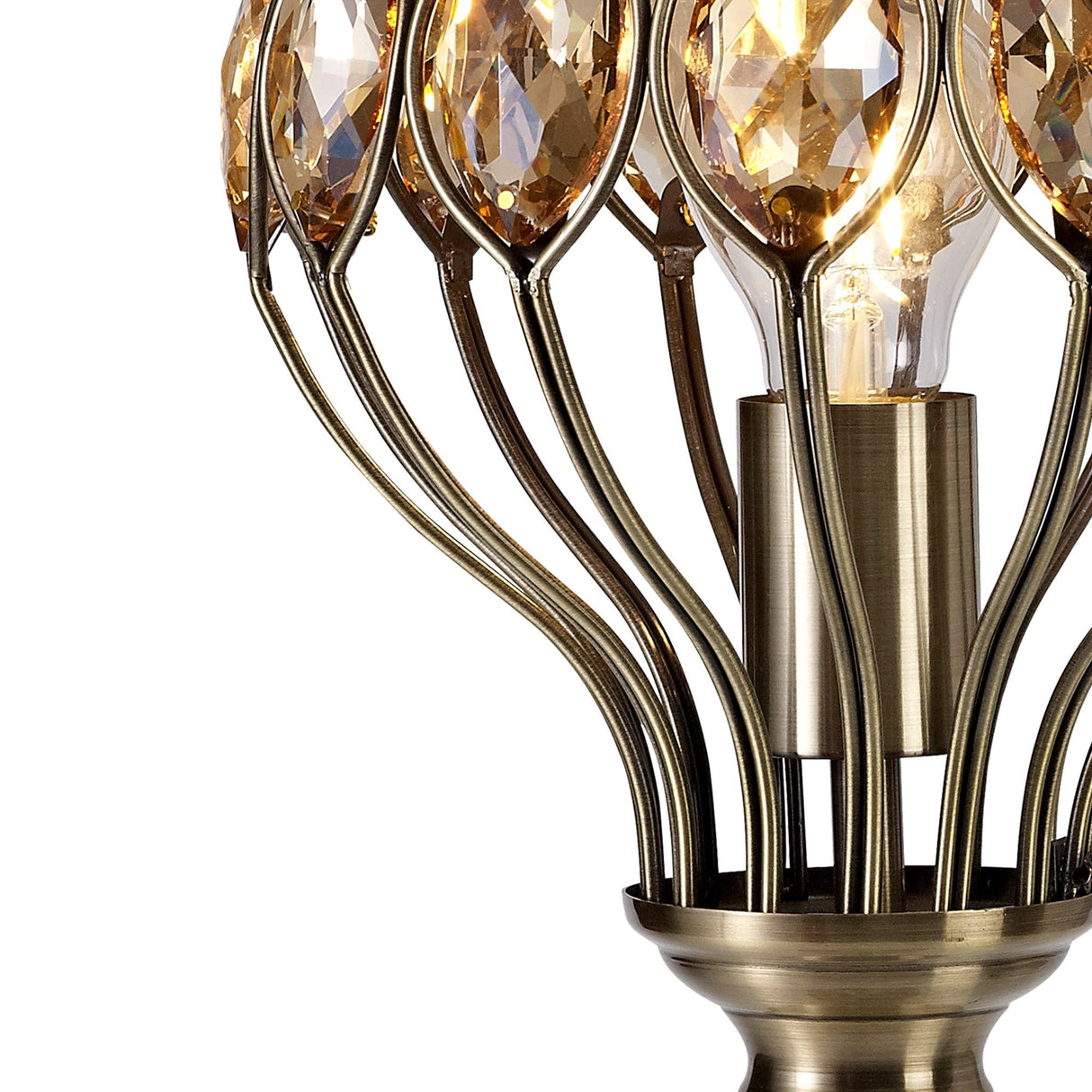 The Marisa 1 Light Crystal Table Lamp features an antique brass base with curved metal rods and amber crystal accents around a visible bulb, adding a touch of luxury lighting to any room.