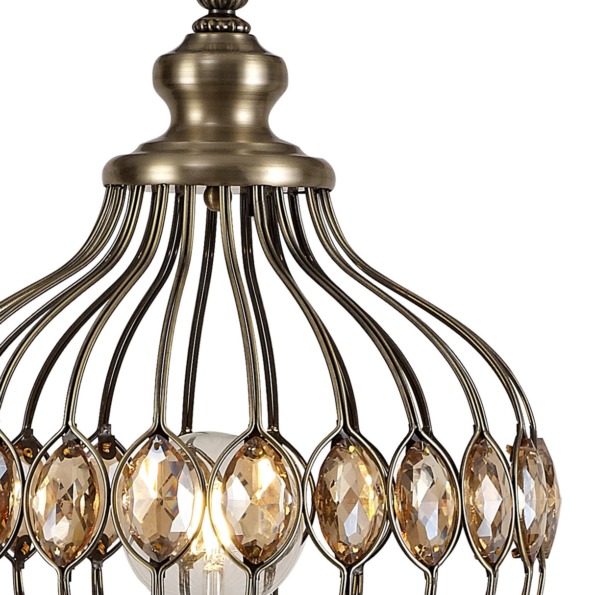 Close-up of the Marisa 1 Light Crystal Floor Lamp in antique brass, featuring curved metal bars and oval crystal accents around a glowing bulb—an elegant statement piece for any space.