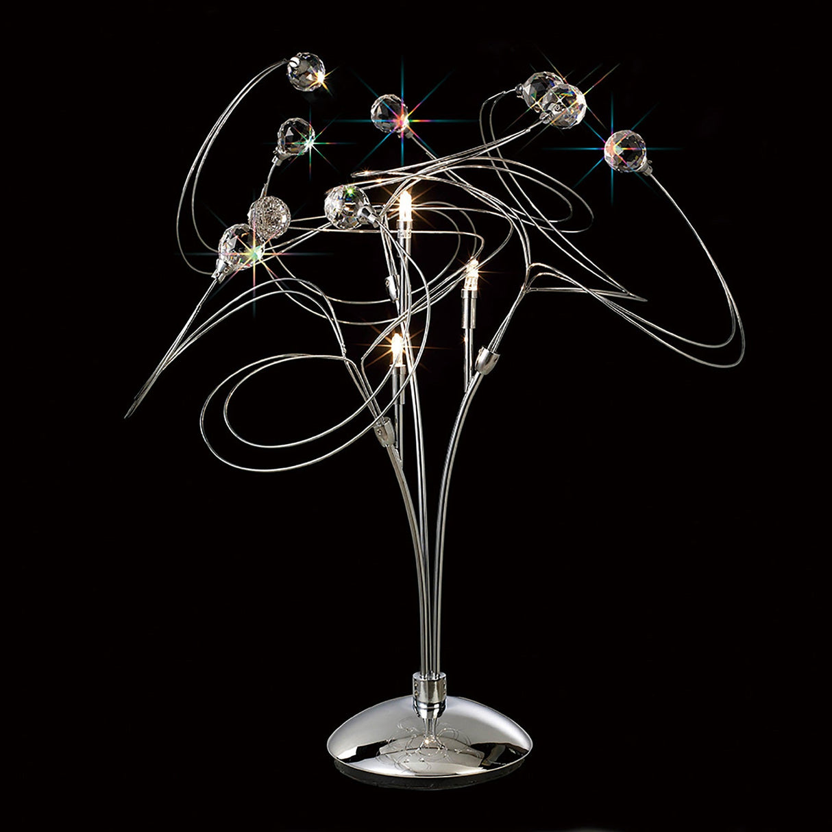 The Messe 3 Light Crystal Table Lamp in polished chrome features curved metal arms, small lights, and Asfour crystal spheres for a striking starburst effect against a black background.
