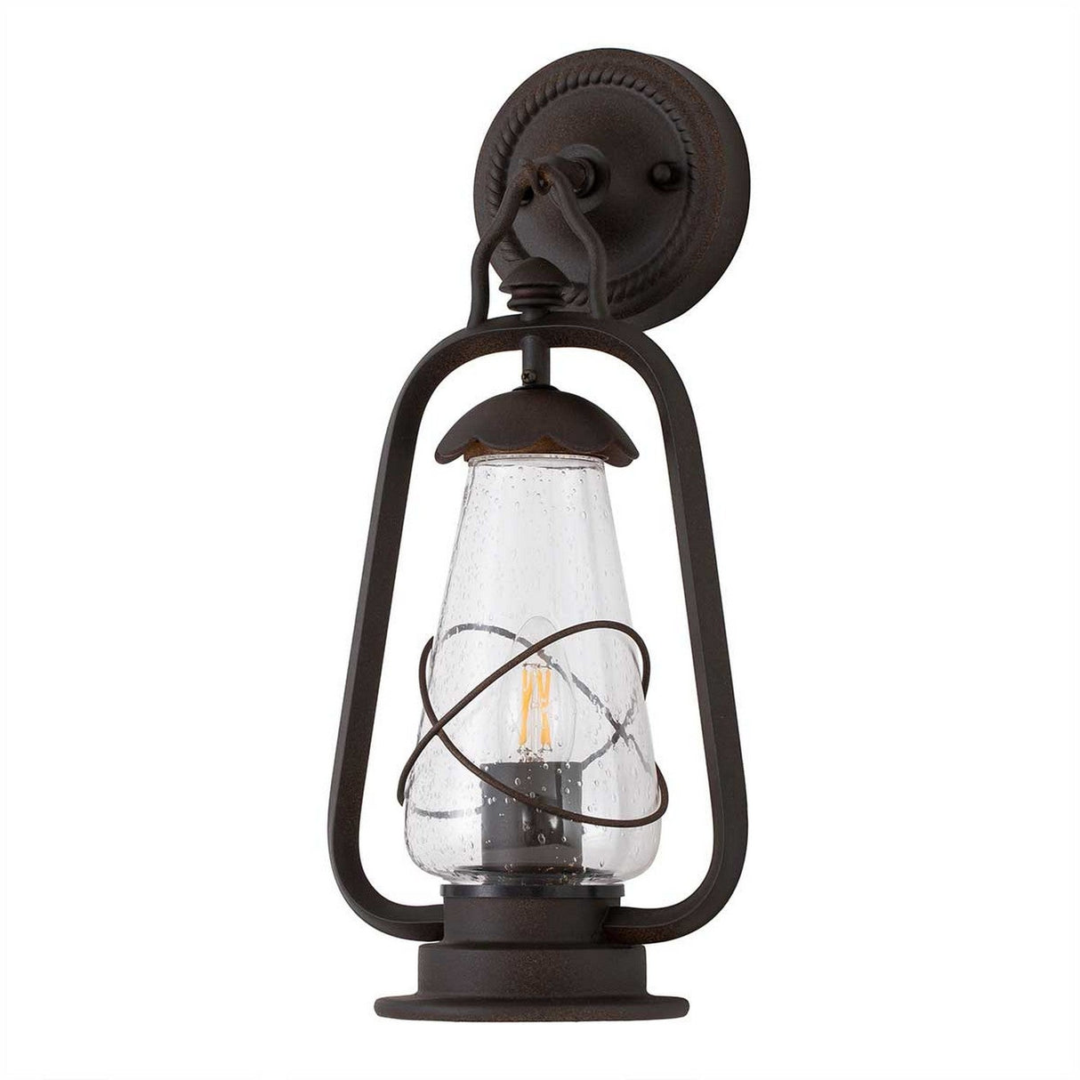The Miners 1 Light Outdoor Wall Light in Old Bronze boasts a vintage design with a clear seeded glass shade encased in an Old Bronze-colored metal frame. This wall lantern features a visible bulb and is attached to a round metal base, making it an ideal choice for adding charm to your exterior.