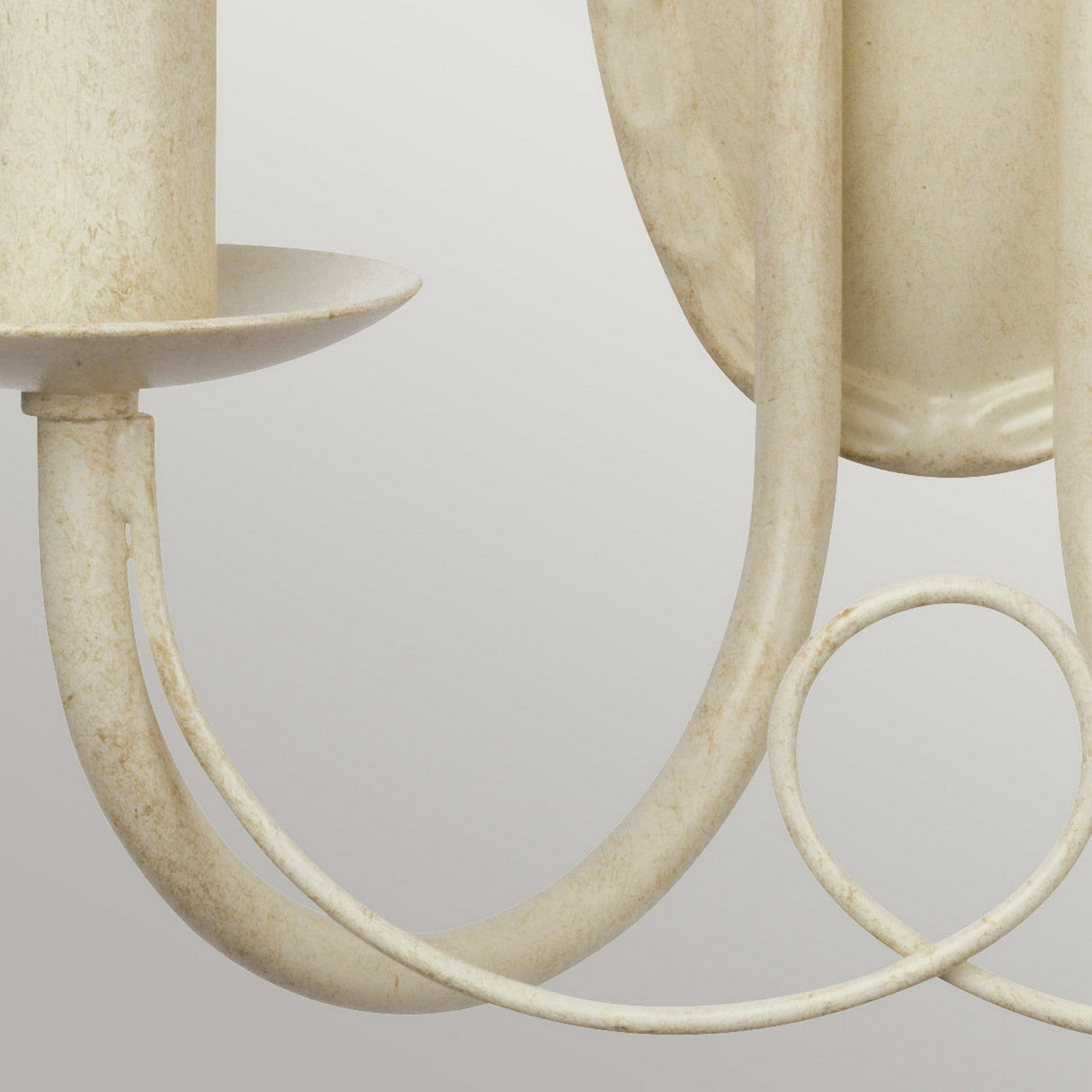 Close-up of the Minster 2 Light Wall Light in an ivory finish with gold patina. The design includes curved metal arms and candle-shaped light holders for E14 bulbs, offering a rustic, vintage-style look.