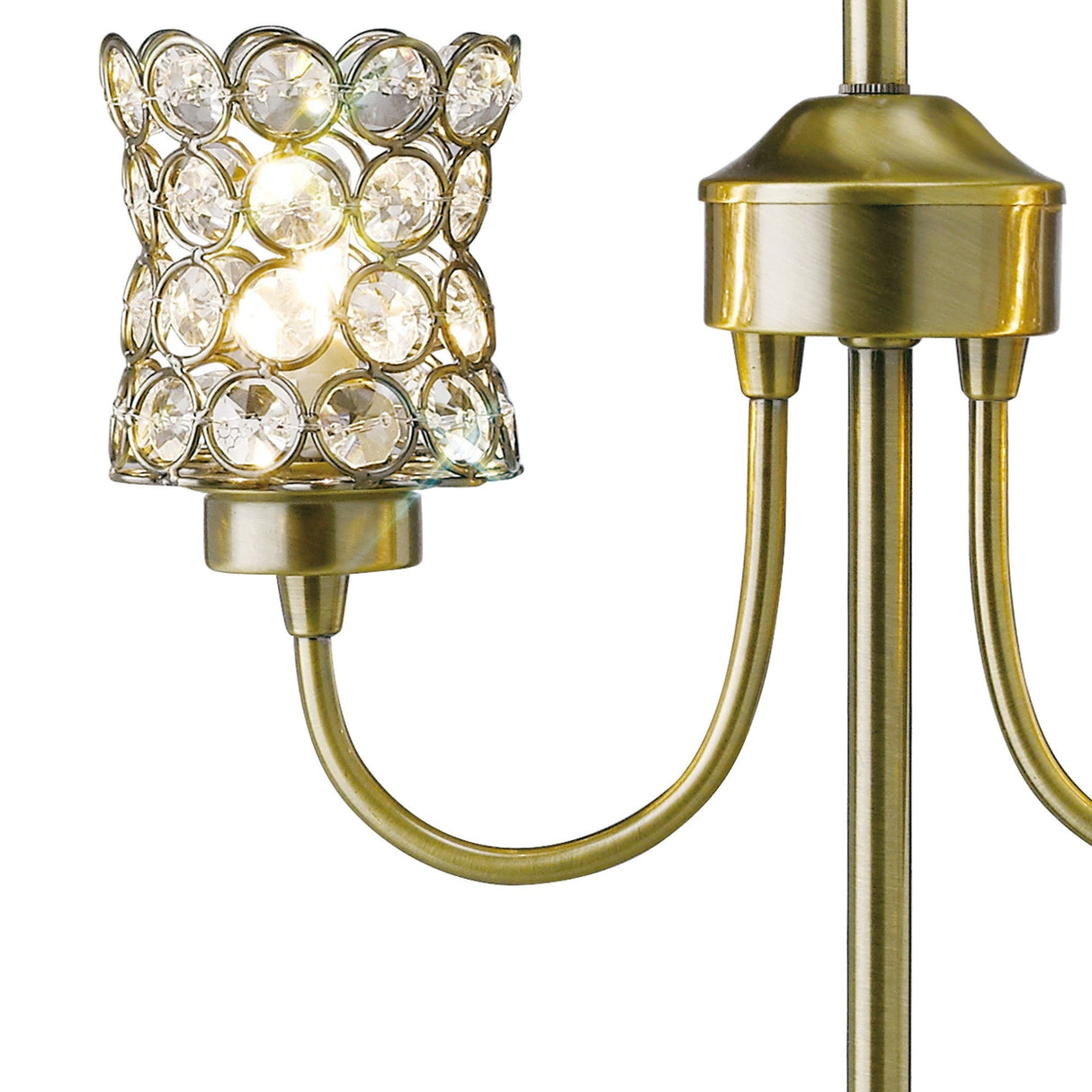 The Nelson 2 Light Crystal Table Lamp in Antique Brass features a decorative crystal lampshade, curved arms, and circular crystal accents that reflect light for an elegant, vintage look.